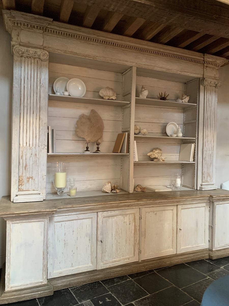 A large open display cupboard/bookcase. Made in Mantua Italy at the end of the 18th century for a monastery from local poplar and pine. Beautifully proportioned neoclassical style with ionic kapitels and fine moulding. Hidden doors in the colomns