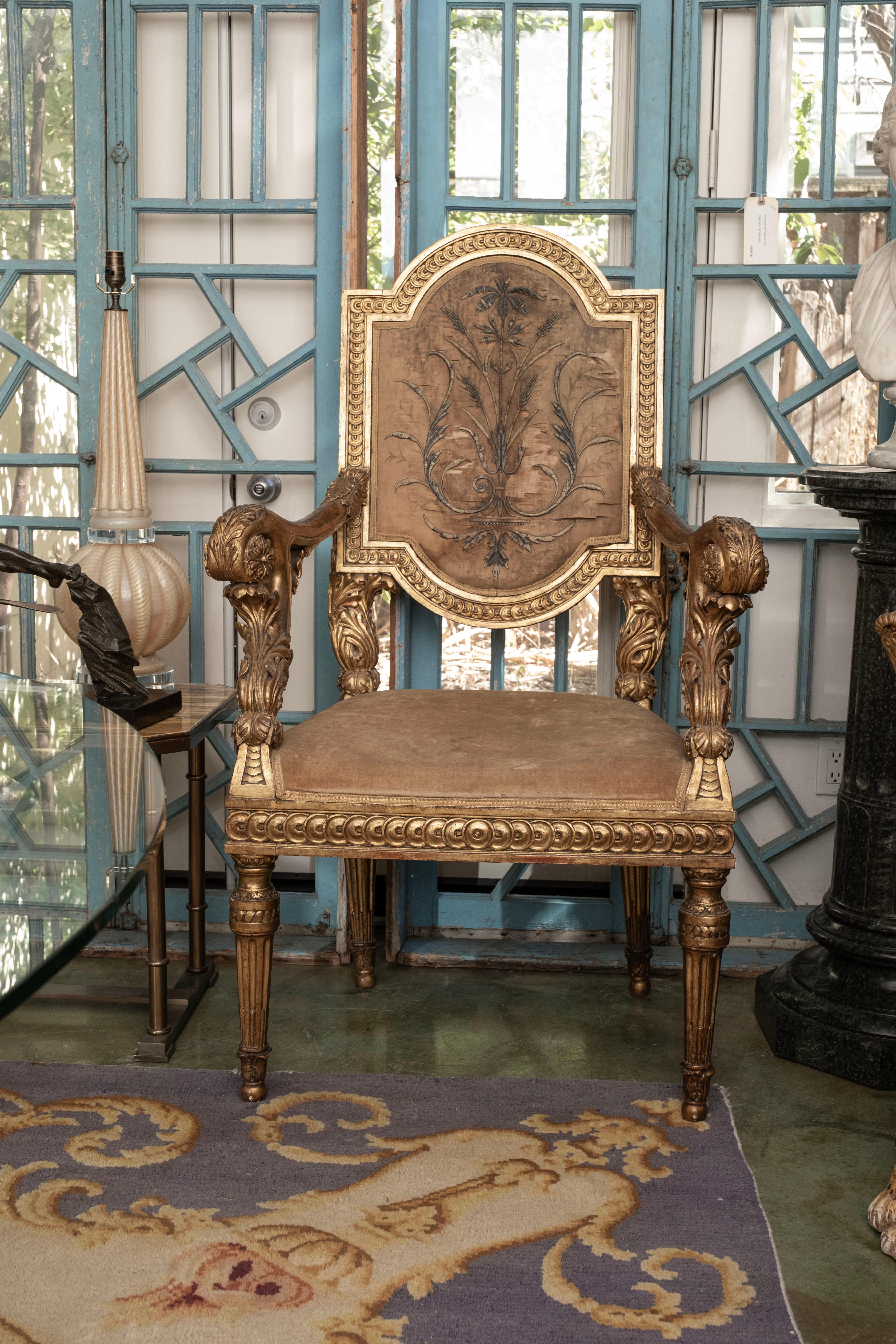 Monumental 18th century Venetian Louis XVI giltwood chair.
This stunning oversized 18th century Italian Louis XVI gilt wood chair, armchair or throne chair is in very good antique condition. The upholstery
is old, possibly original. Leave as is or
