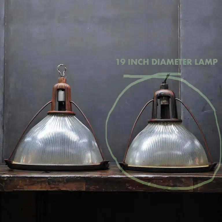 This listing is for lamps identical to the lamp fixtures shown on the right side in the last three images showing a pair. You are buying lamps identical to the one on the right.  It is still very large at 19 inches in diameter, as stated in this