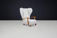 Monumental 1930s French Wingback Armchair in Ivory Bouclé with Sculpted Frame