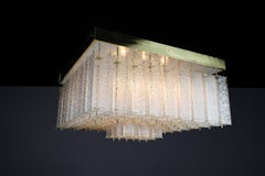 Monumental 1960s Bohemian Flush Mount Chandelier in Textured Glass and Brass.