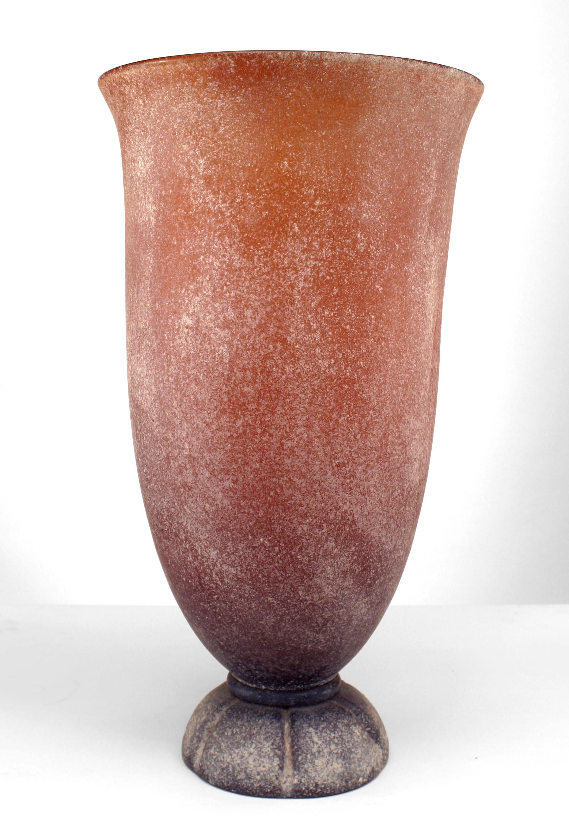 Signed by Karl Springer, this monumental art glass vases dates to the 1970's and is characterized by its textured, rust colored, and speckled white glass surface.