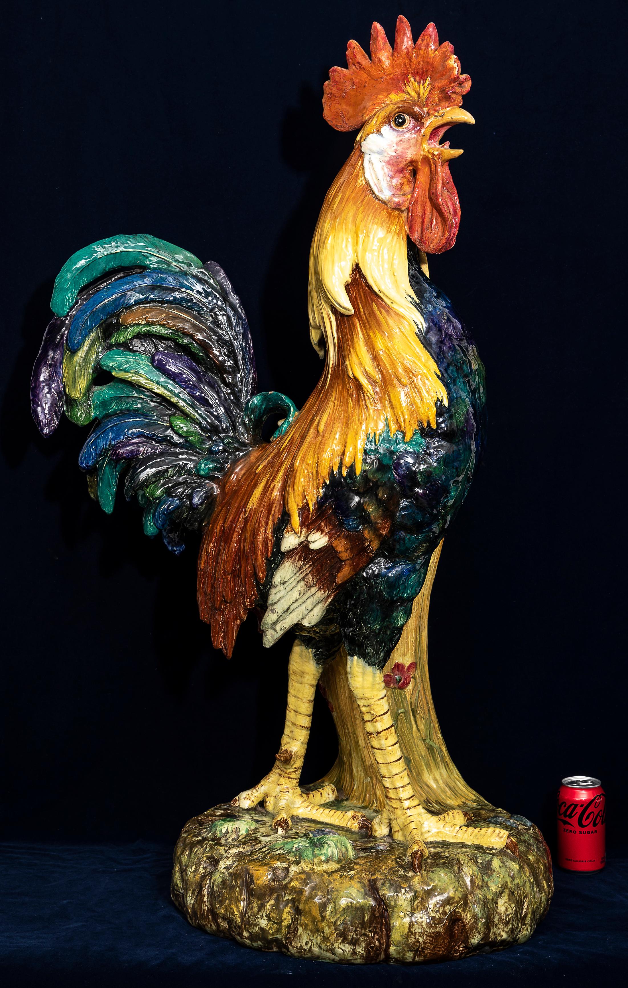 A Monumental 19th Century French Hand-Painted Majolica Rooster Vase Signed by Jerome Massier. The body is modeled in high relief with a textured surface simulating feathers. The tail feathers extend outward, curving and overlapping, with a mix of