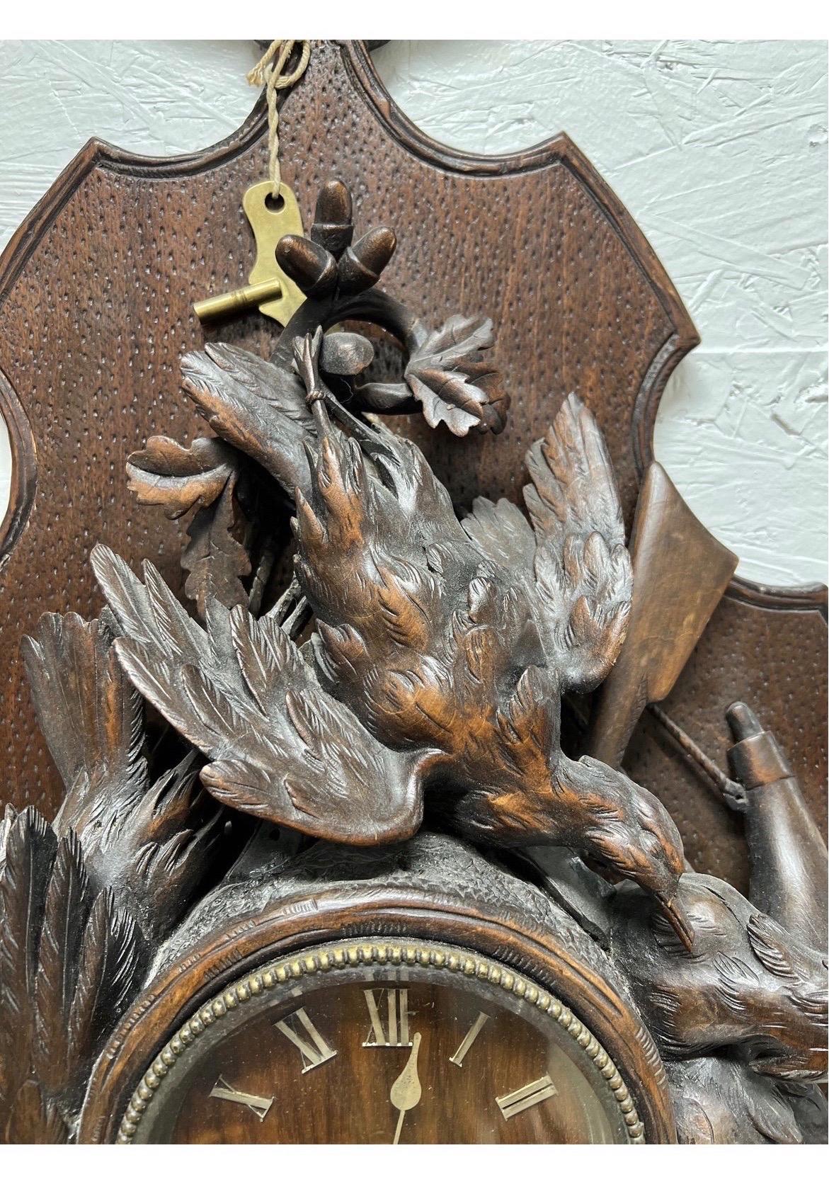 One of the most impressive masterfully carved German or Swiss black forest wall clocks I have ever had in my possession circa 1880. The shear size and quality of the carvings is incredible.
Adorned with several duck and bird forms to the clock, a
