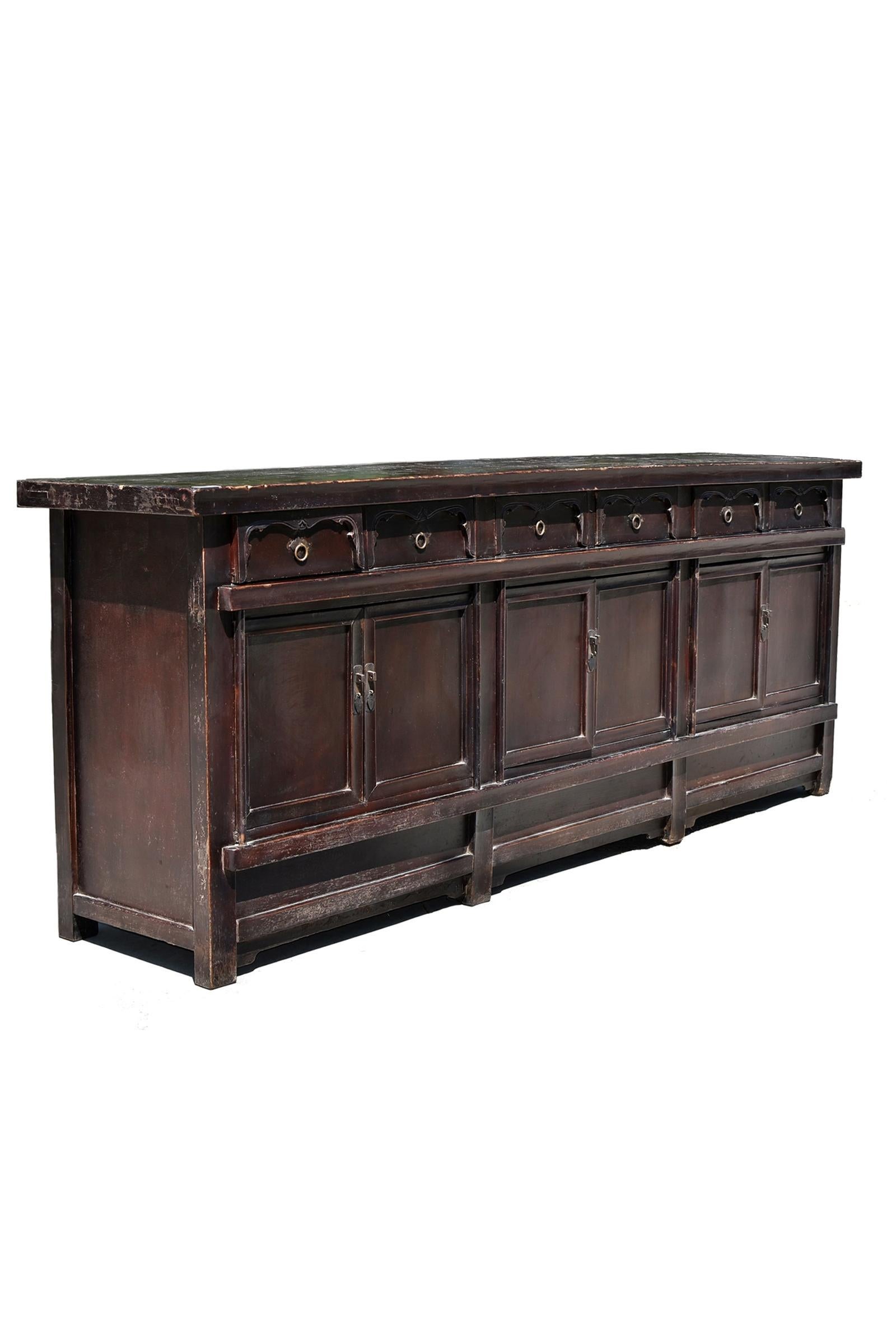 A monumental 9 feet 8 inches solid wood sideboard from early 19th century. The top is made of solid boards in 2.5