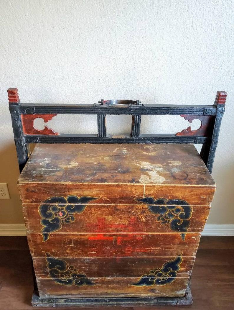 A phenomenal hand carved and painted wooden antique wedding dowry stacked drawer carriage chest from China. Commissioned in the 19th century to commemorate the wedding of a new bride and likely given as part of her dowry. After being filled, two