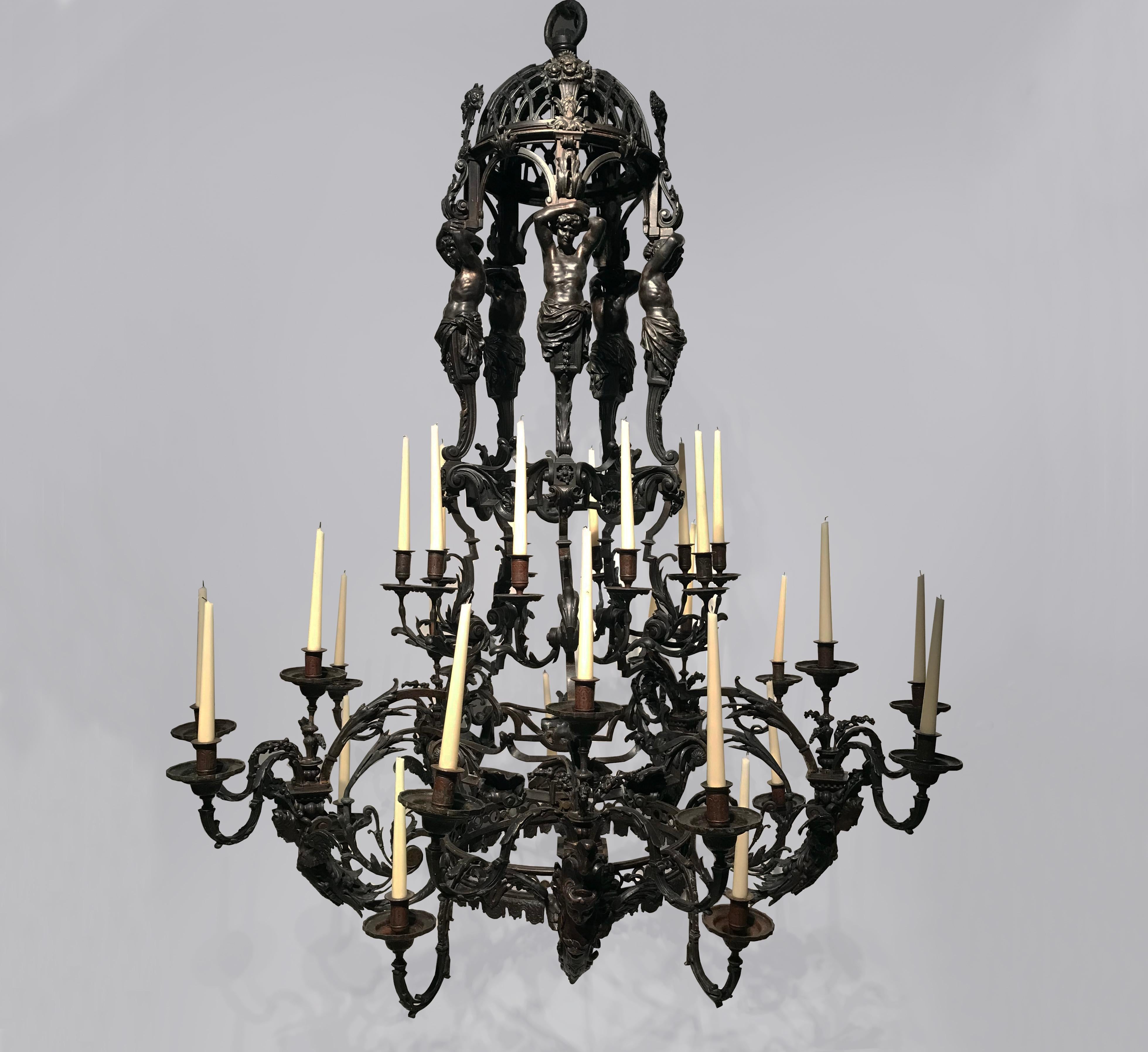 19th French bronze chandelier of palatial proportions and exquisite quality. 

This magnificent 30-light chandelier has a pierced domed corona supported by five beautifully cast solid bronze male caryatid supports, above scrolled acanthus tiers each