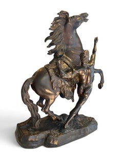 Imposante statue française du XIXe siècle représentant un dompteur de chevaux, en bronze, d'après Guillaume Coustou