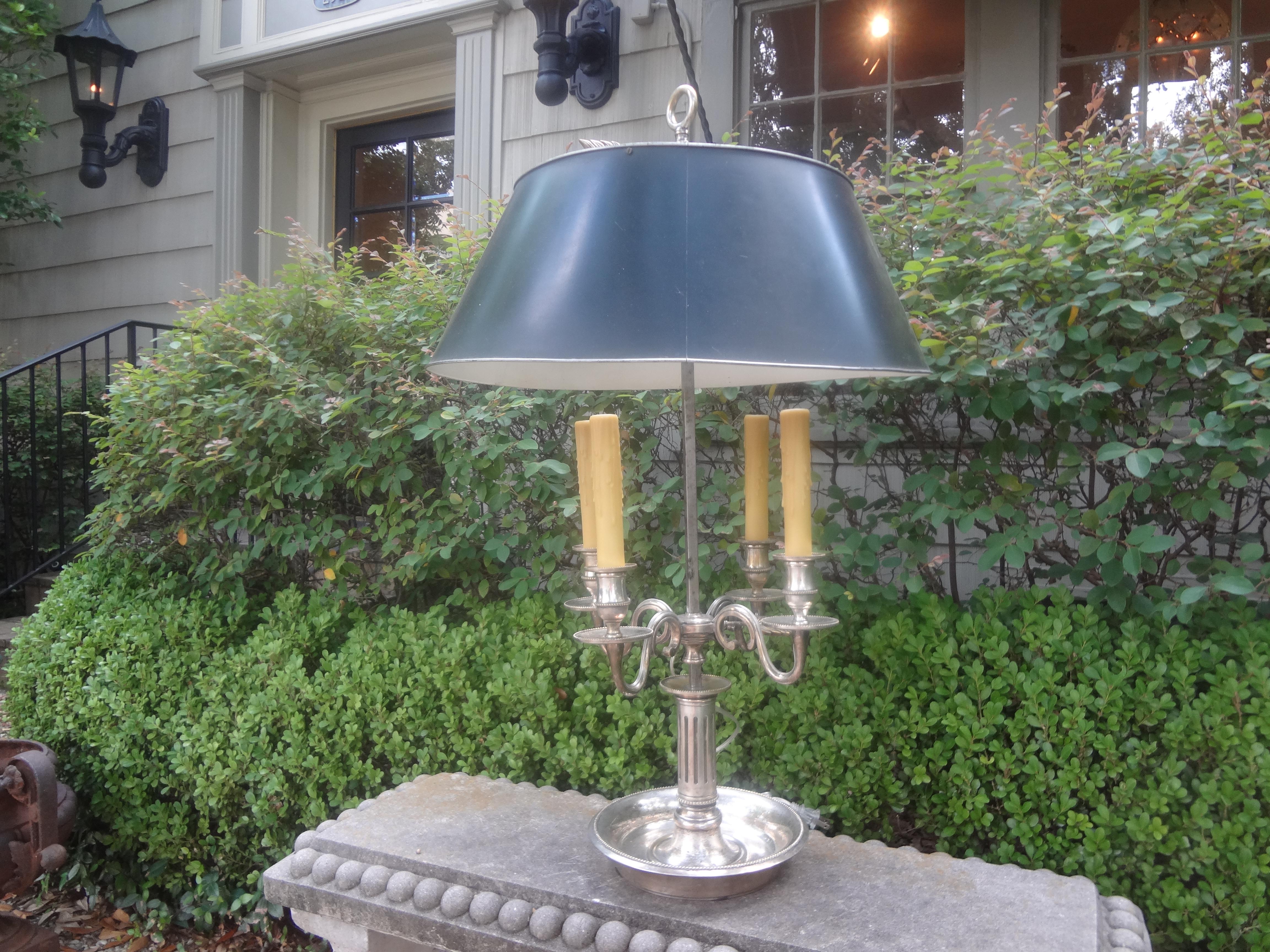 Monumental 19th Century French Louis XVI Style Bouillotte Lamp.
This stunning antique French Louis XVI style silvered bronze bouillotte lamp or desk lamp with four lights and a black tole shade has been newly French wired with new sockets for the