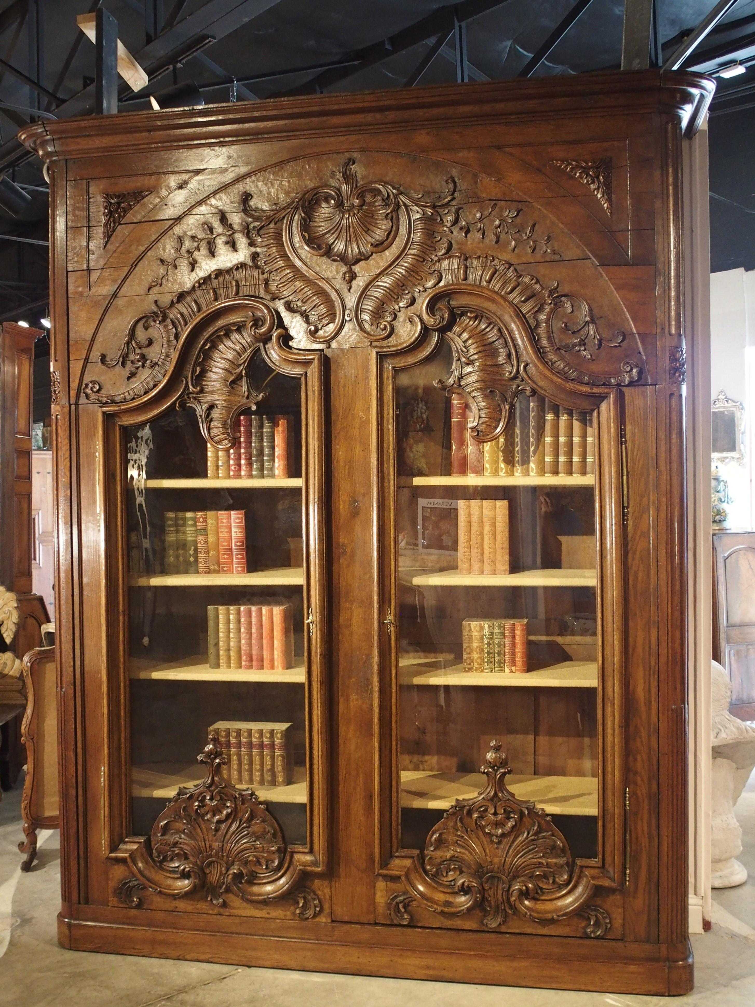 This incredibly unique French bibliotheque is made from carved Oak and dates to the 1800s. Measuring exactly 9 1/2 feet tall and 92 inches wide and boasting some intricately carved woodwork, this piece makes a strong visual impact.

We have it