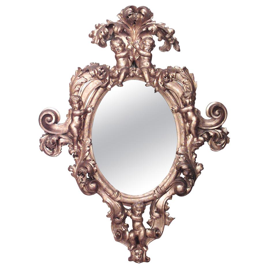 French Victorian Monumental Carved Giltwood Cupid Design Wall Mirror For Sale