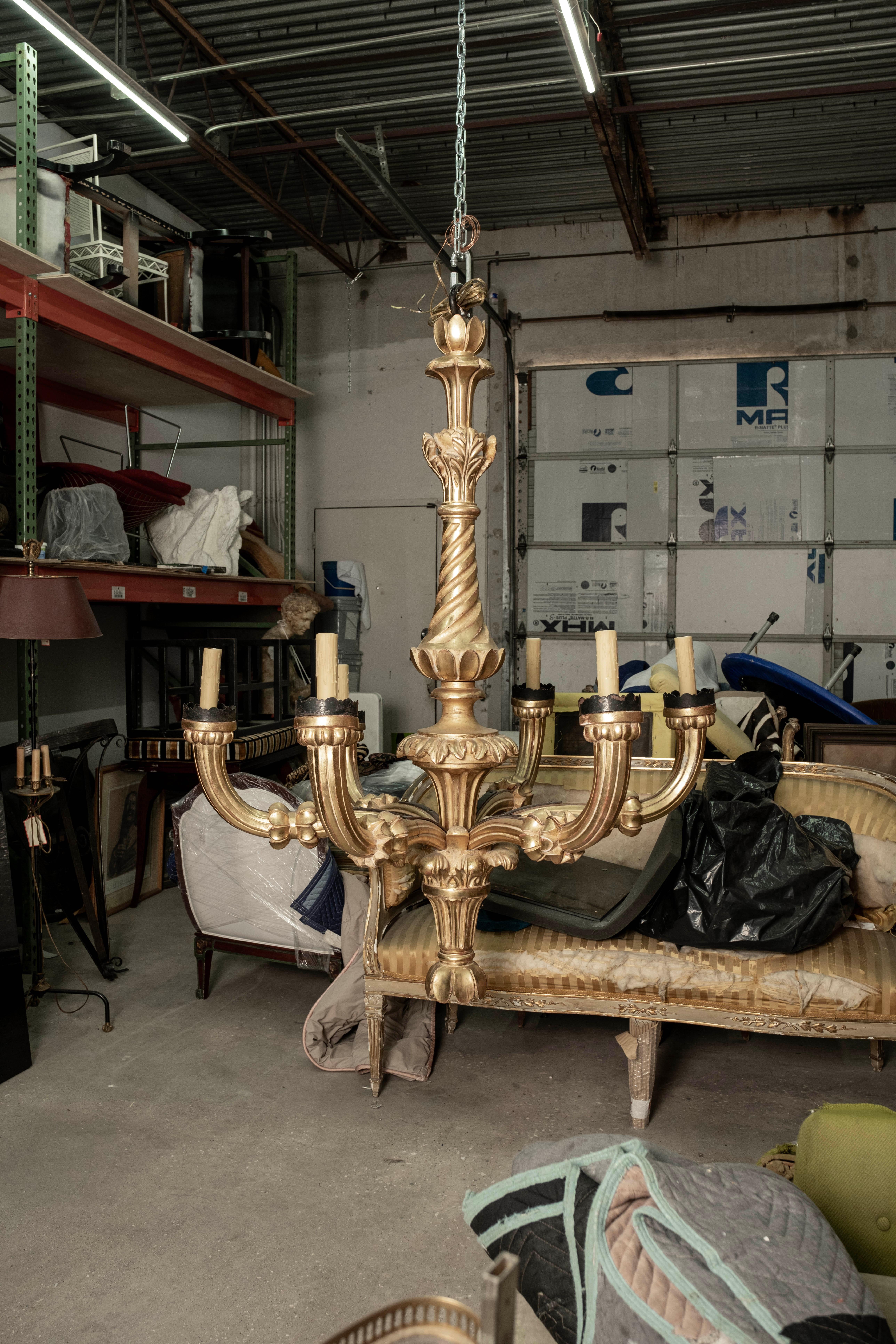 Monumental 19th century Italian giltwood chandelier. This stunning magnificent large scale Italian gilt wood six light Baroque style chandelier from Tuscany has fabulous patina and has been newly wired with new sockets for the U.S. market including