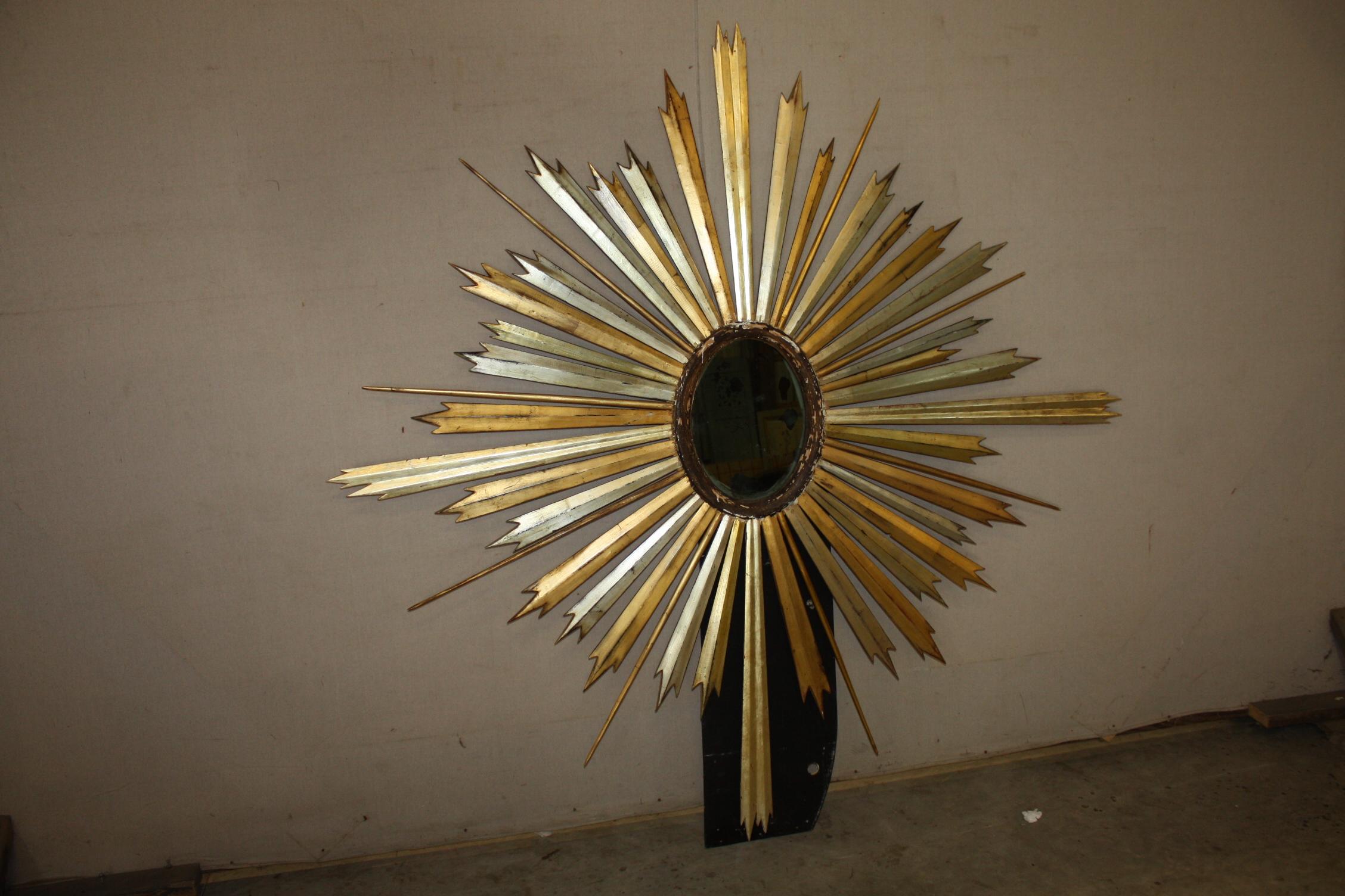 This is a great looking sunburst mirror from the 1800s. The glass is original and shows some age.