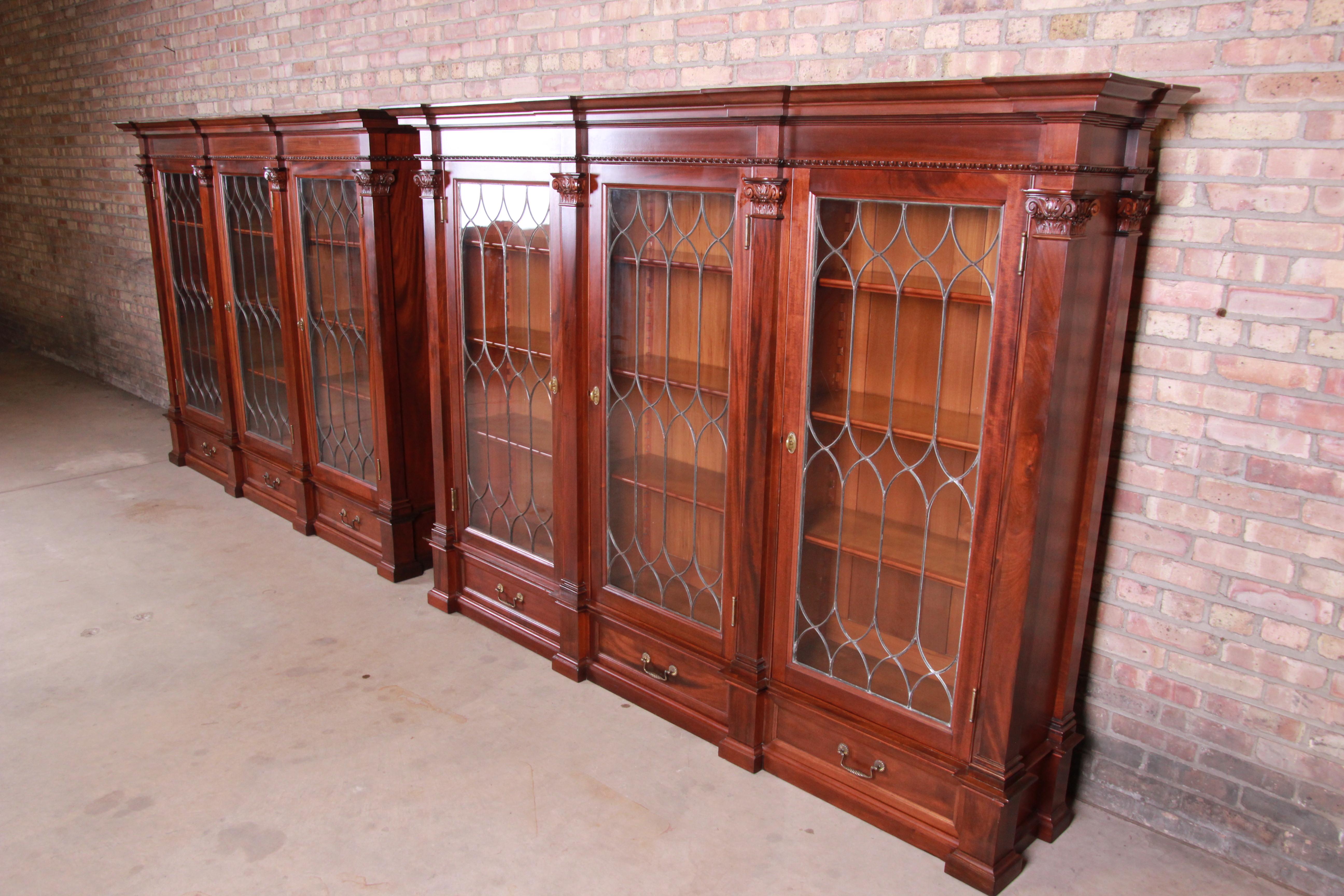 A rare and outstanding pair of monumental antique Victorian triple bookcases

USA, circa 1860s

Solid carved mahogany, with leaded glass doors and original brass hardware.

Measures: 91.13