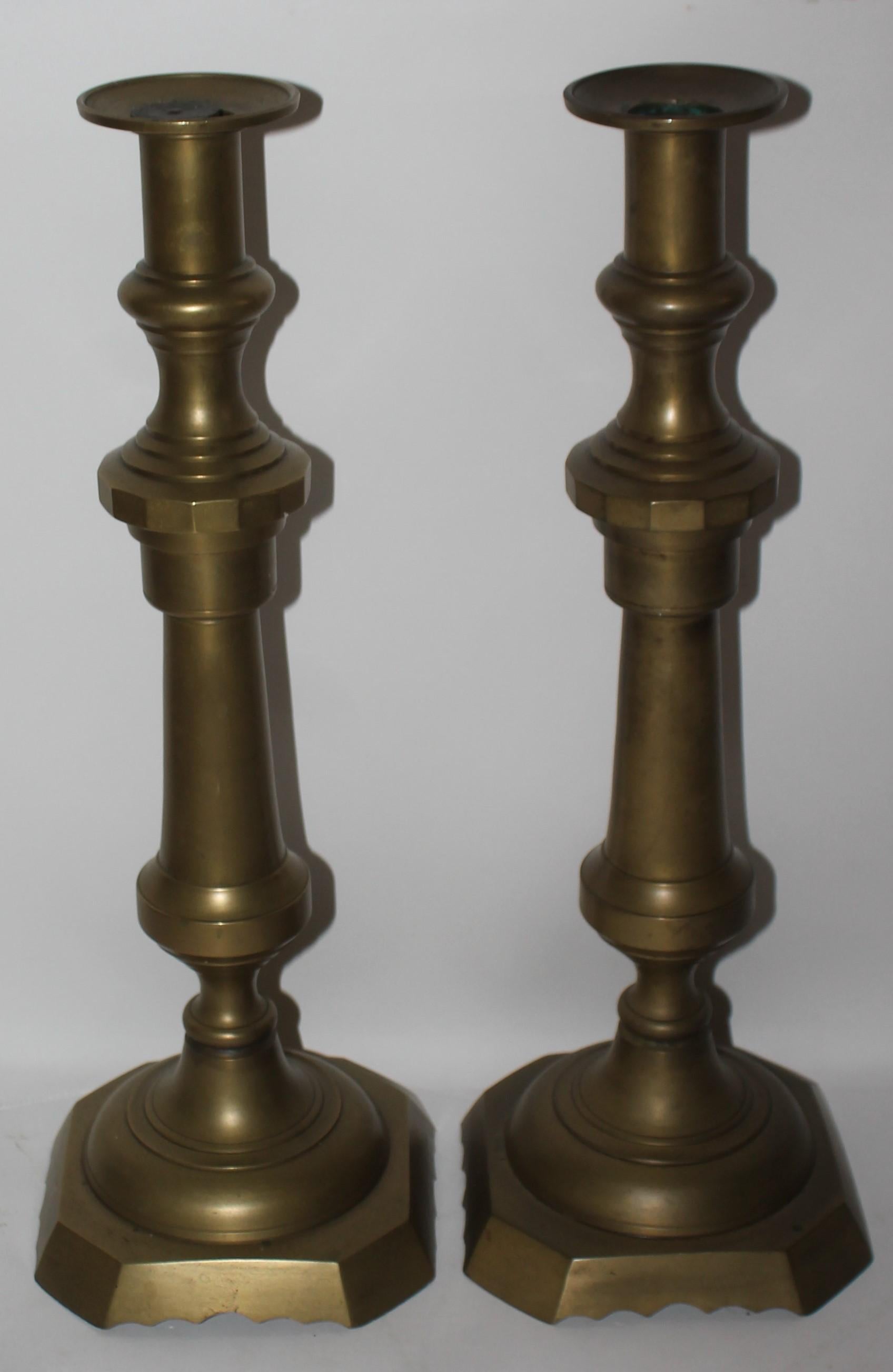 This fine large push up bottom early 19th century candleholders are in great as found condition. These are huge brass candlestick holders.