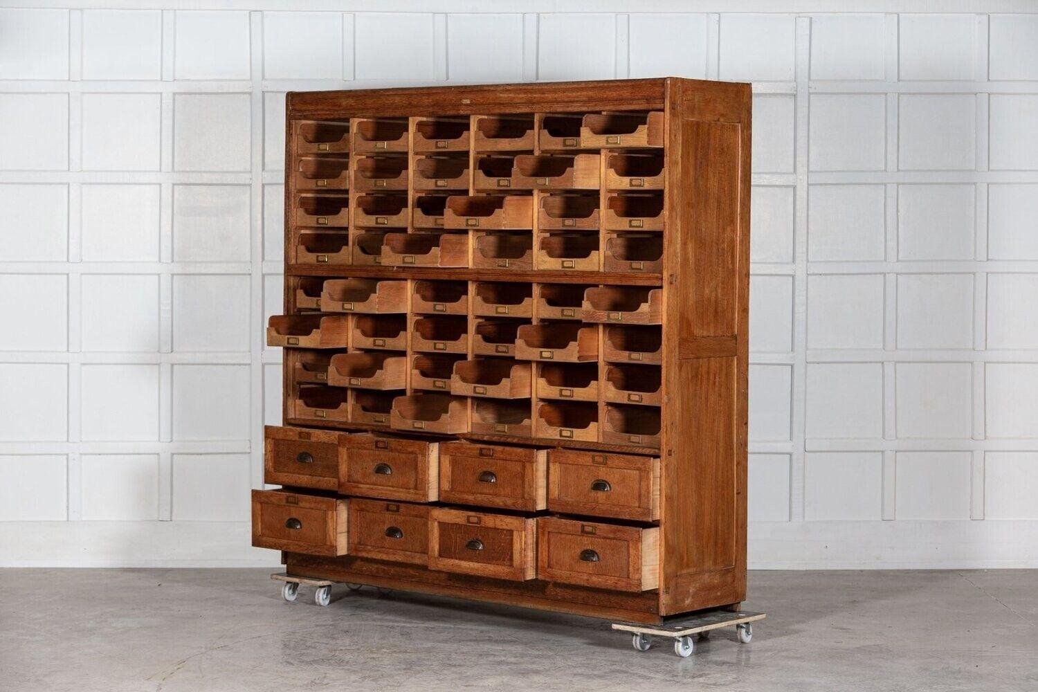 1920
Monumental 19th C English oak haberdashery cabinet with 56 drawers.
An exceptional example
sku 1260.
Measures: W198 x D51 x H198 cm.