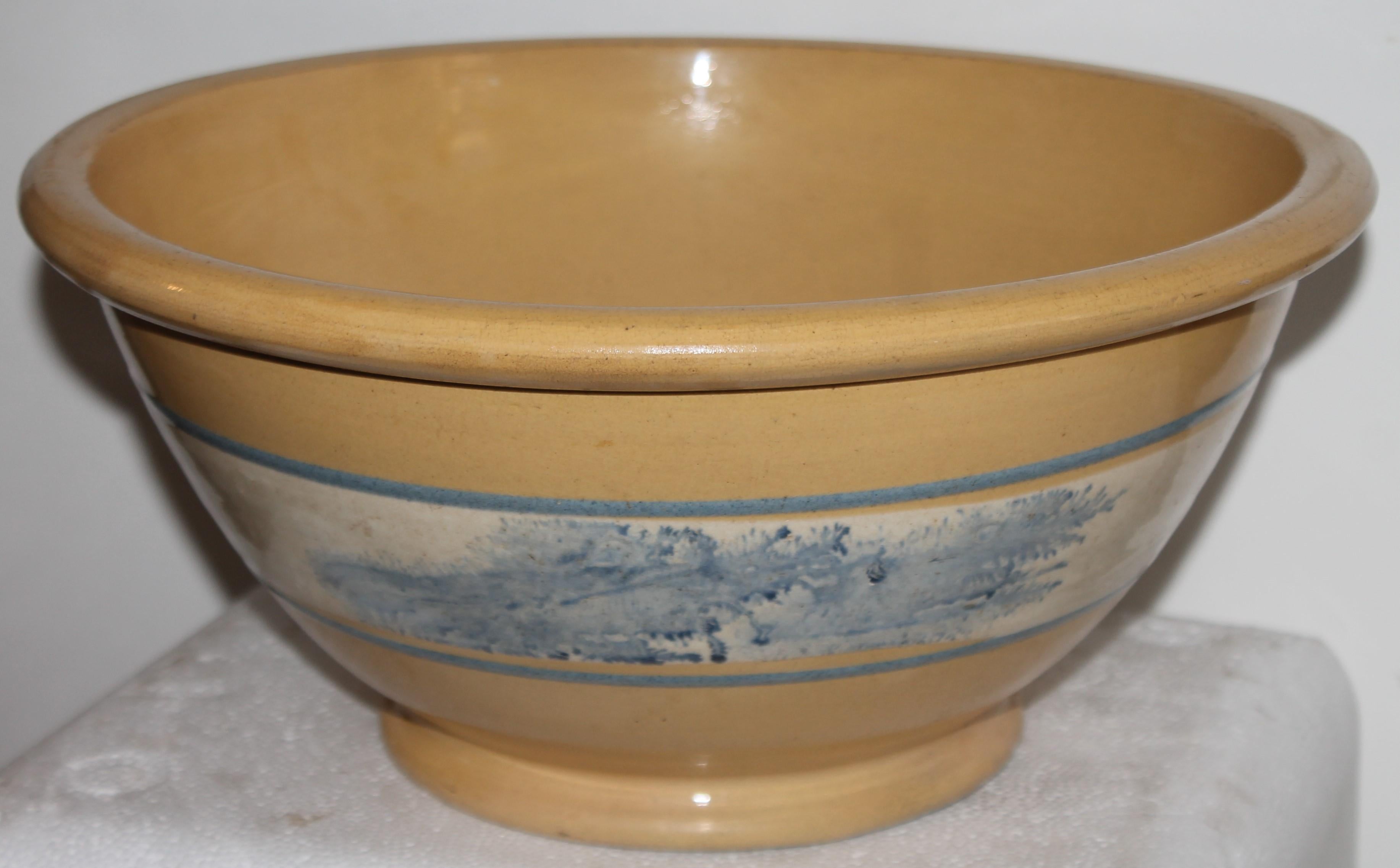 This gigantic yellow ware seaweed mocha mixing bowl is in fine condition. It has amazing light blue sea weed decoration. Fantastic large bowl!!