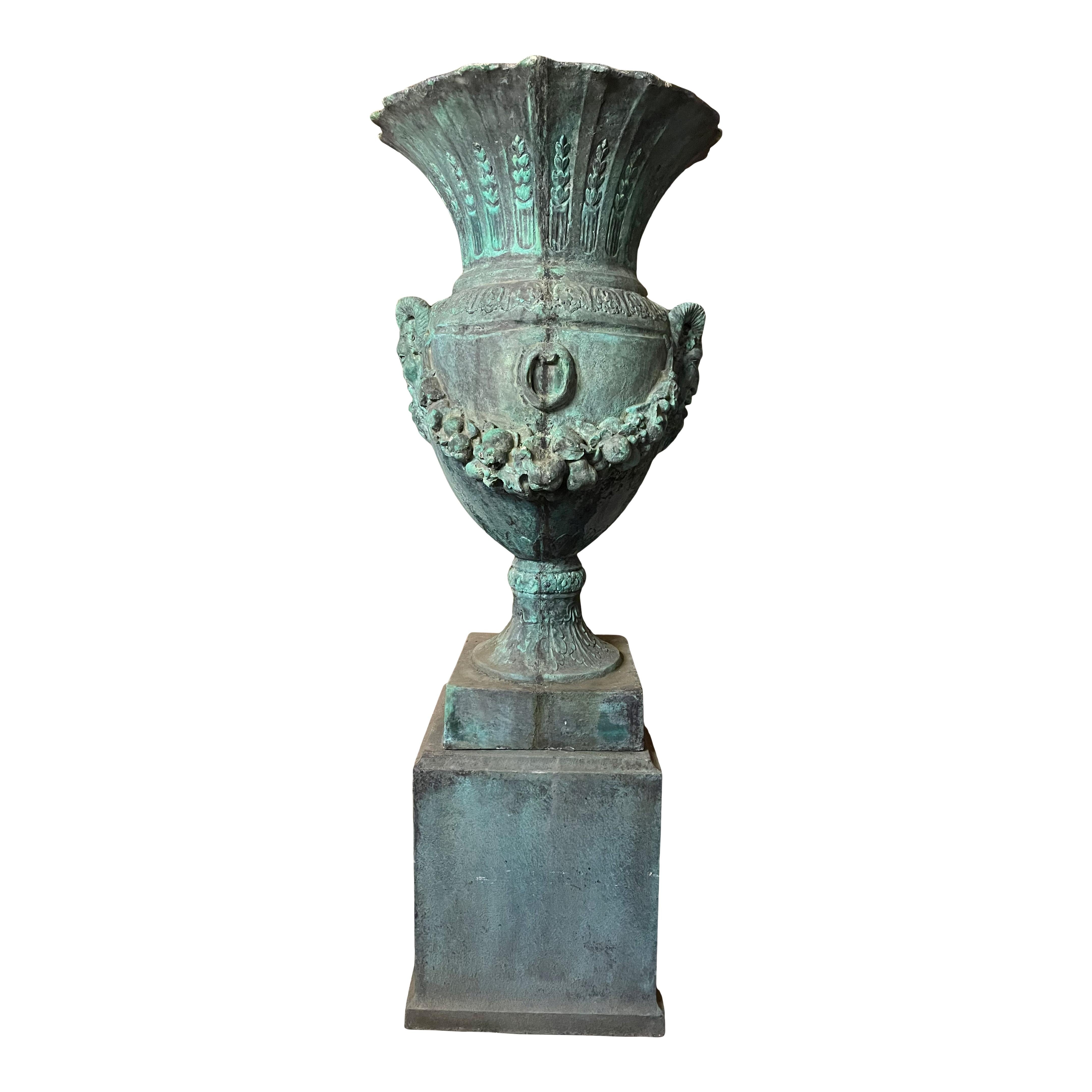 If you're looking to make a statement at the front of the drive or just looking for that piece with some wow factor in the back garden, this monumental verdi gris fibeglass, 20th century classical urn on pedestal could certainly be the piece to do