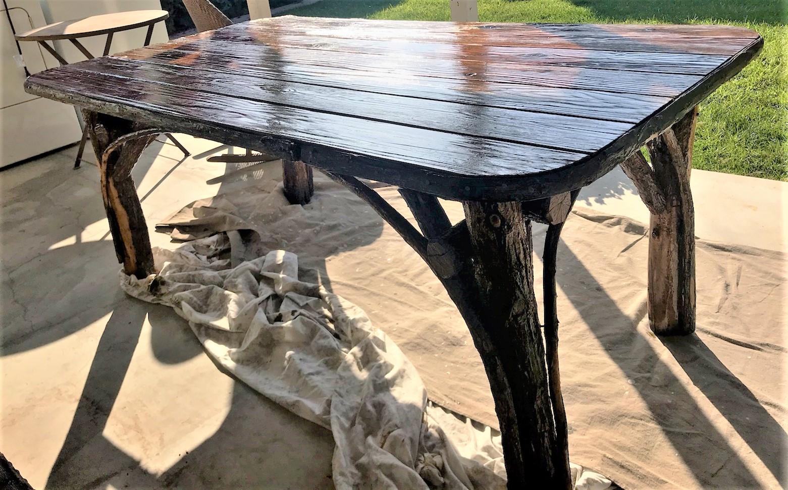 This monumental bark covered hickory table was found in the mid-west and in good condition. It can seat up to six or eight people comfortably. This table is very strong and heavy. The condition is very good and has minor wear of the bark in areas.