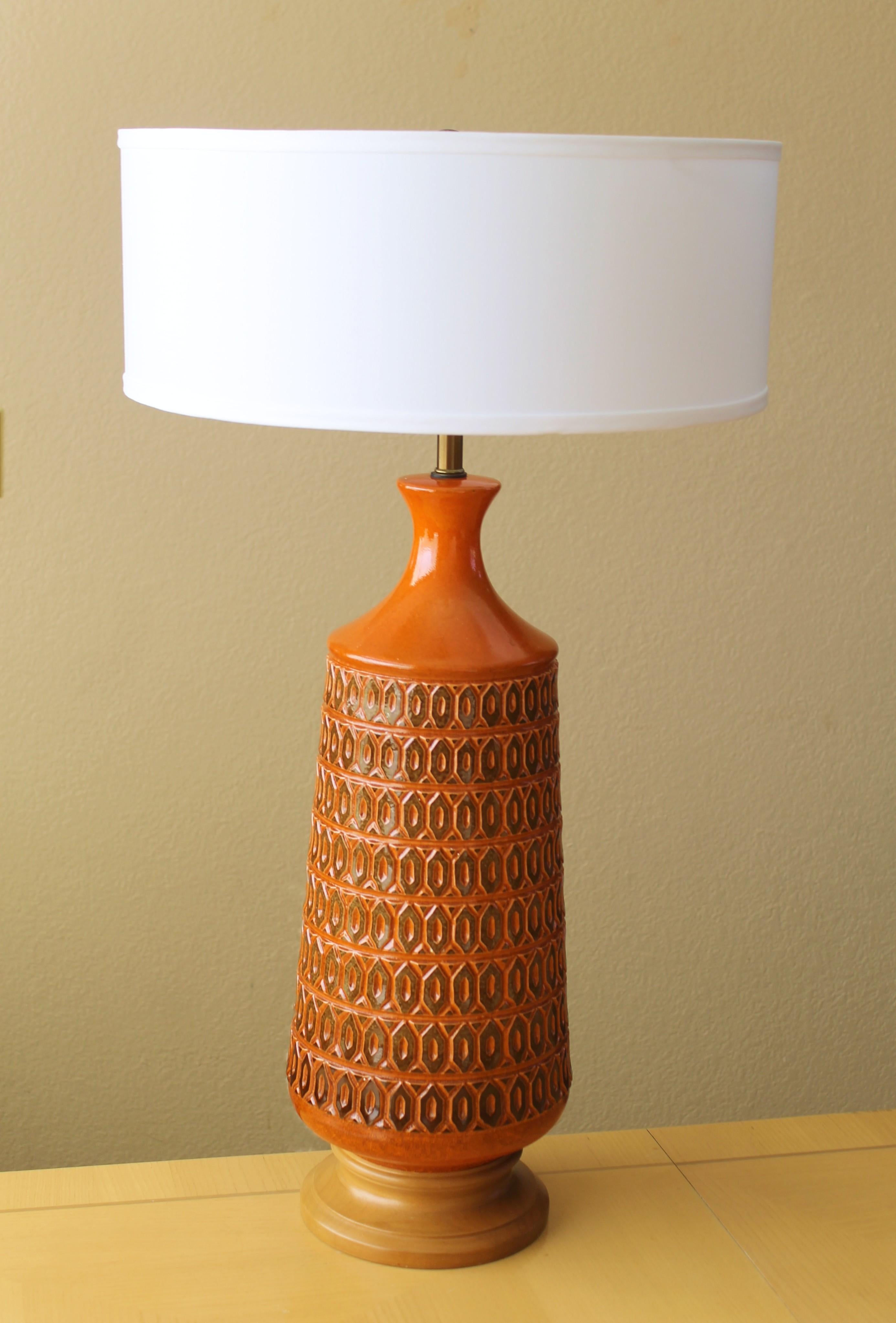 Magnificent!

Stunning Orange Sculptured
Italian Pottery Table Lamp
For Raymor

Attributed to Aldo Londi

This sensational lamp is a testimony to the Italian pottery house of the mid century!  Magnificent detail that took incredible work to sculpt