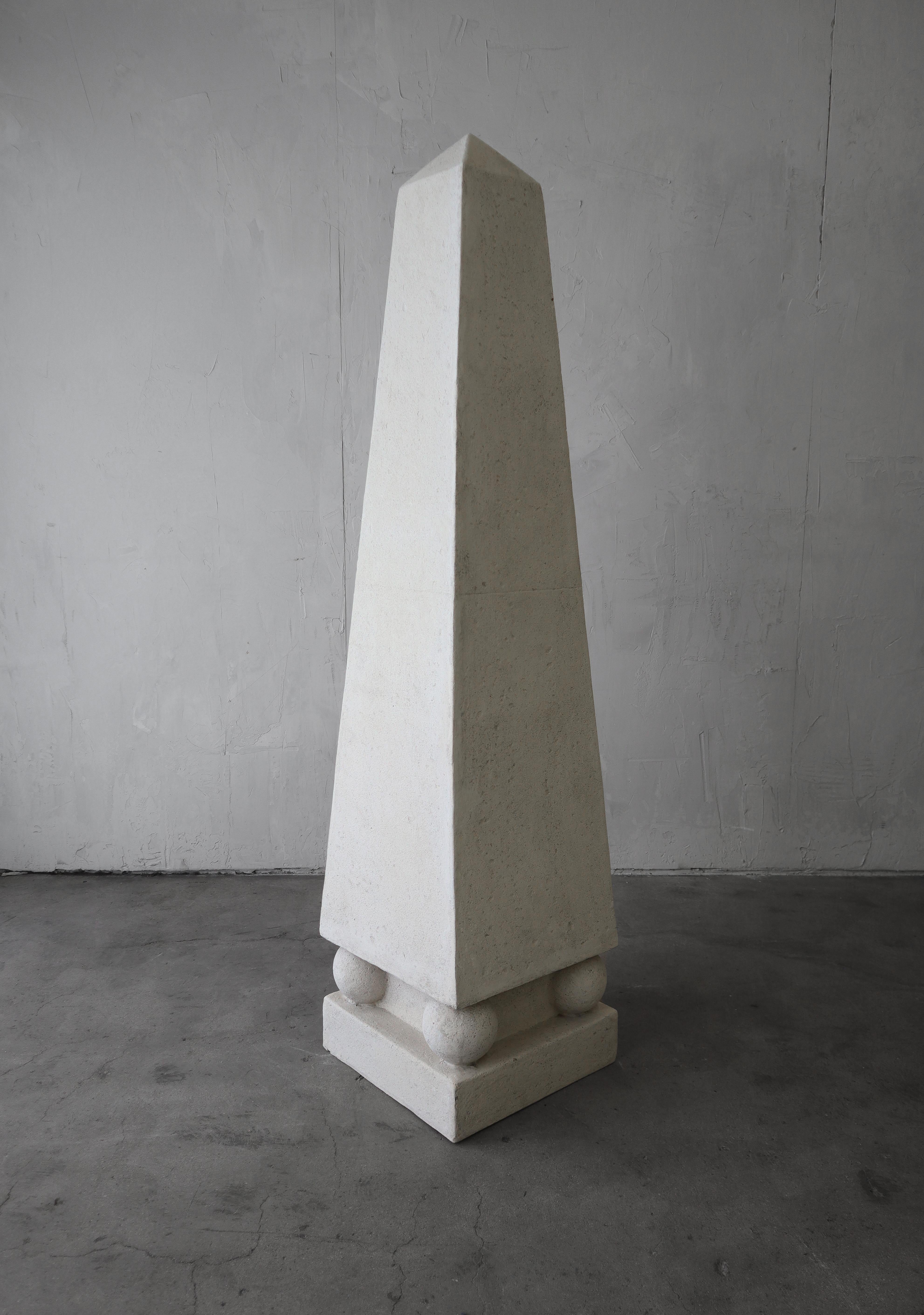 Monumental obelisk floor sculpture. Can be used indoors or out as a super cool, architectural decor accent.

Constructed out of fiberglass and covered in a fine sand like plaster. Some minimal marks and color variations, but they add to the depth
