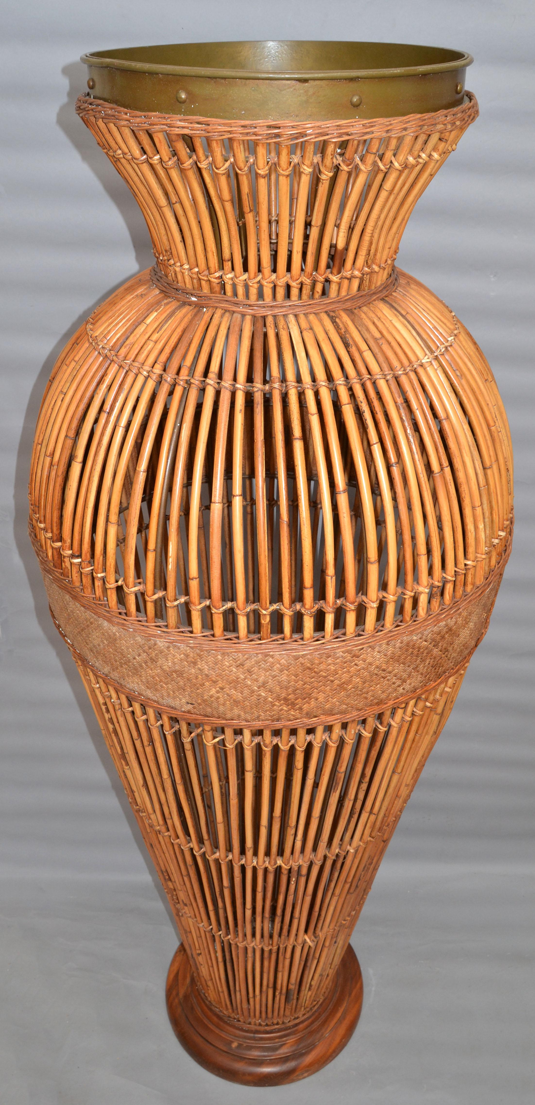 Huge floor vase made out of bamboo, cane and brass Bohemian style and designed in the Mid-Century Modern period.
All handmade and would be great for a Lobby in a Hotel.
Coastal Outdoor and Indoor Garden Elements for Your Tropical Resort Setting.
