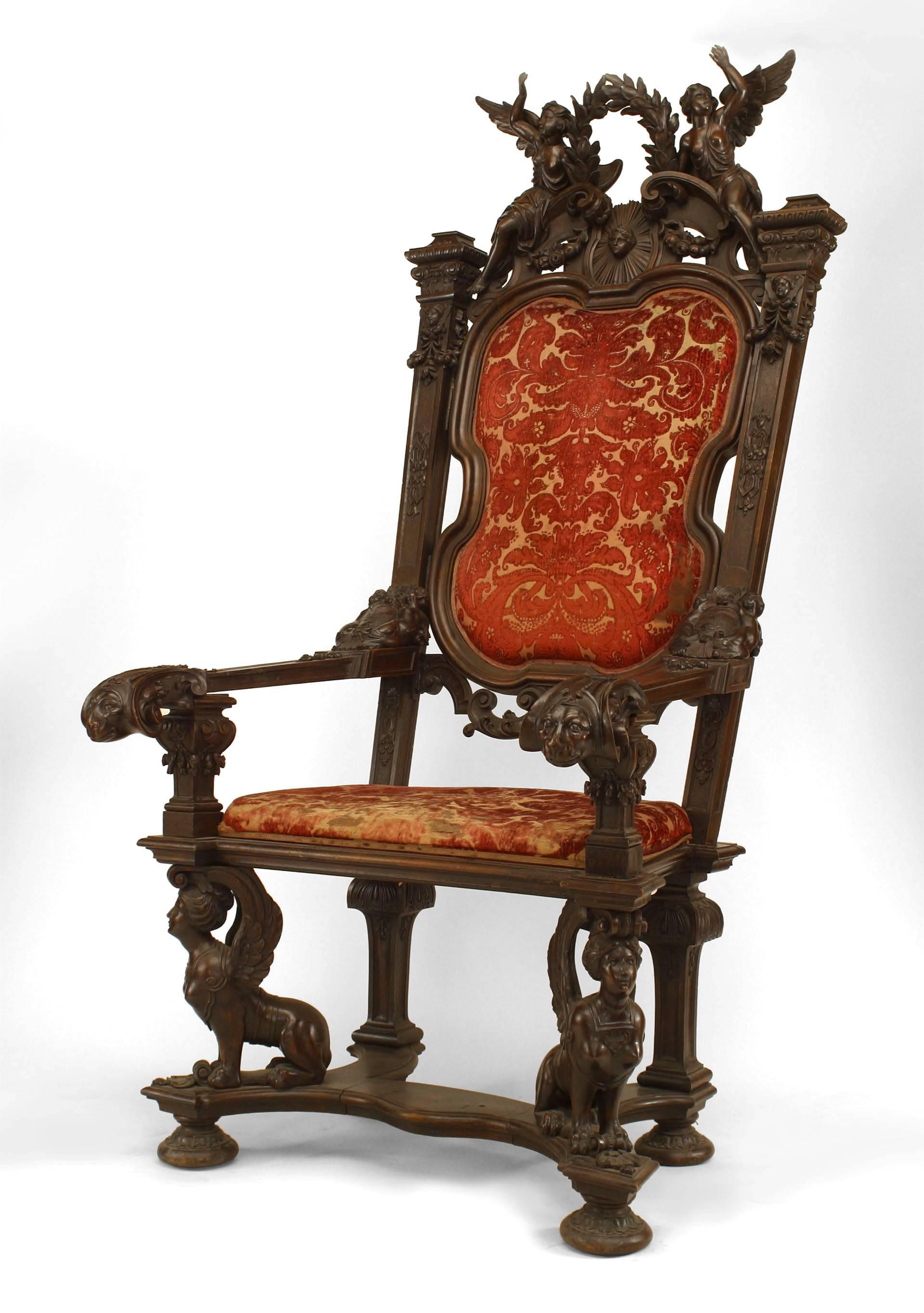 Fauteuil trône monumental en noyer de style Empire français (19ème siècle) avec figure sculptée avec couronne et tapisserie en velours rouge.
