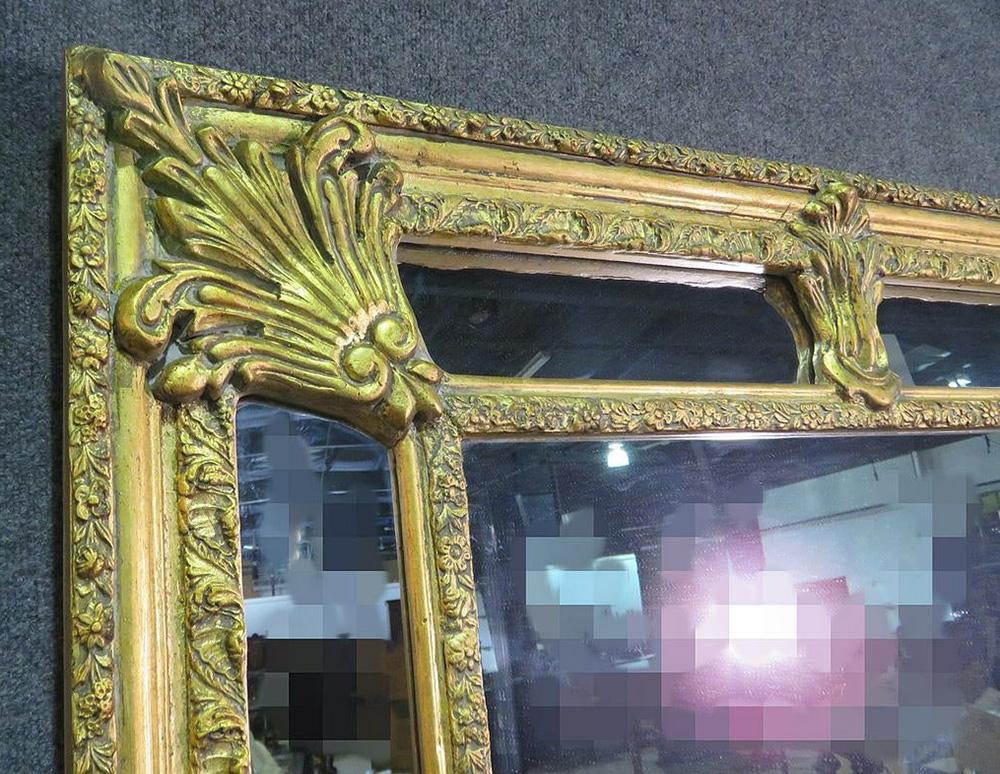 This is a gorgeous carved wood and glass gilded mirror. Measures: 76 1/4