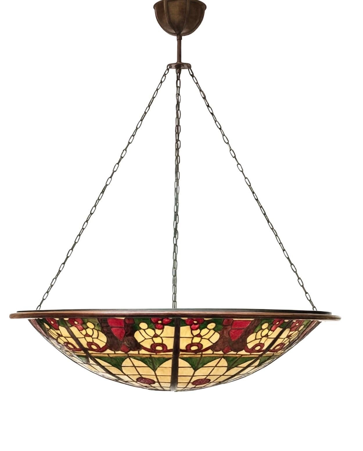 This monumental mid-century stained glass dome chandelier, dating from around the 1960s–70s, features a breathtaking 200 cm (78.7 in) diameter and is constructed entirely from hand-cut, leaded stained glass. The dome is supported by its original