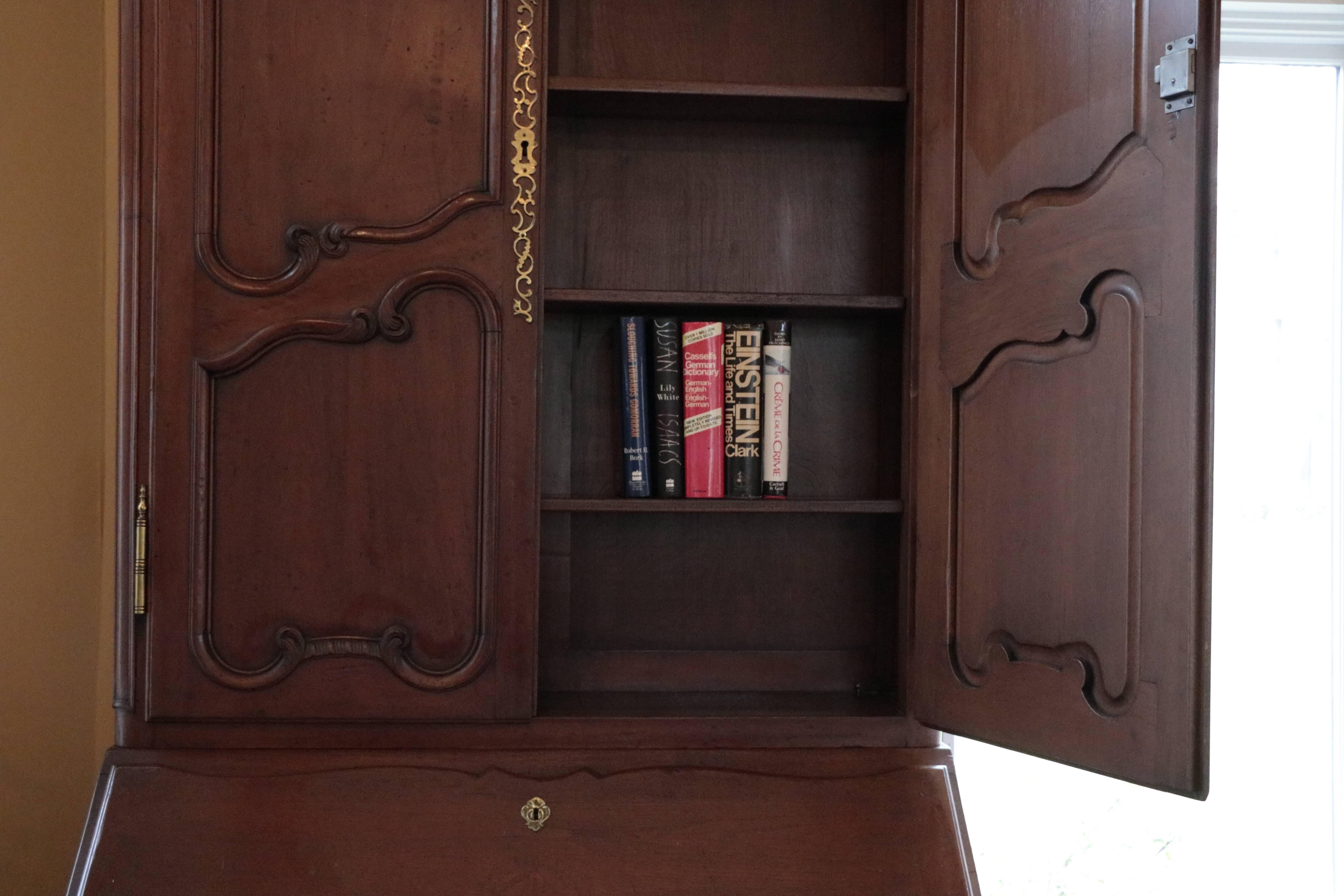 Monumental Old World Charmer Mahogany  Don Rousseau Monumental Louis XV Secretary.  Hand Carved Details, Brass Handles, Pulls and Escutcheons. Four deep and Long Shelves  - Three Fabulously designed  Drawers with tons of storage.
Old World Charm.