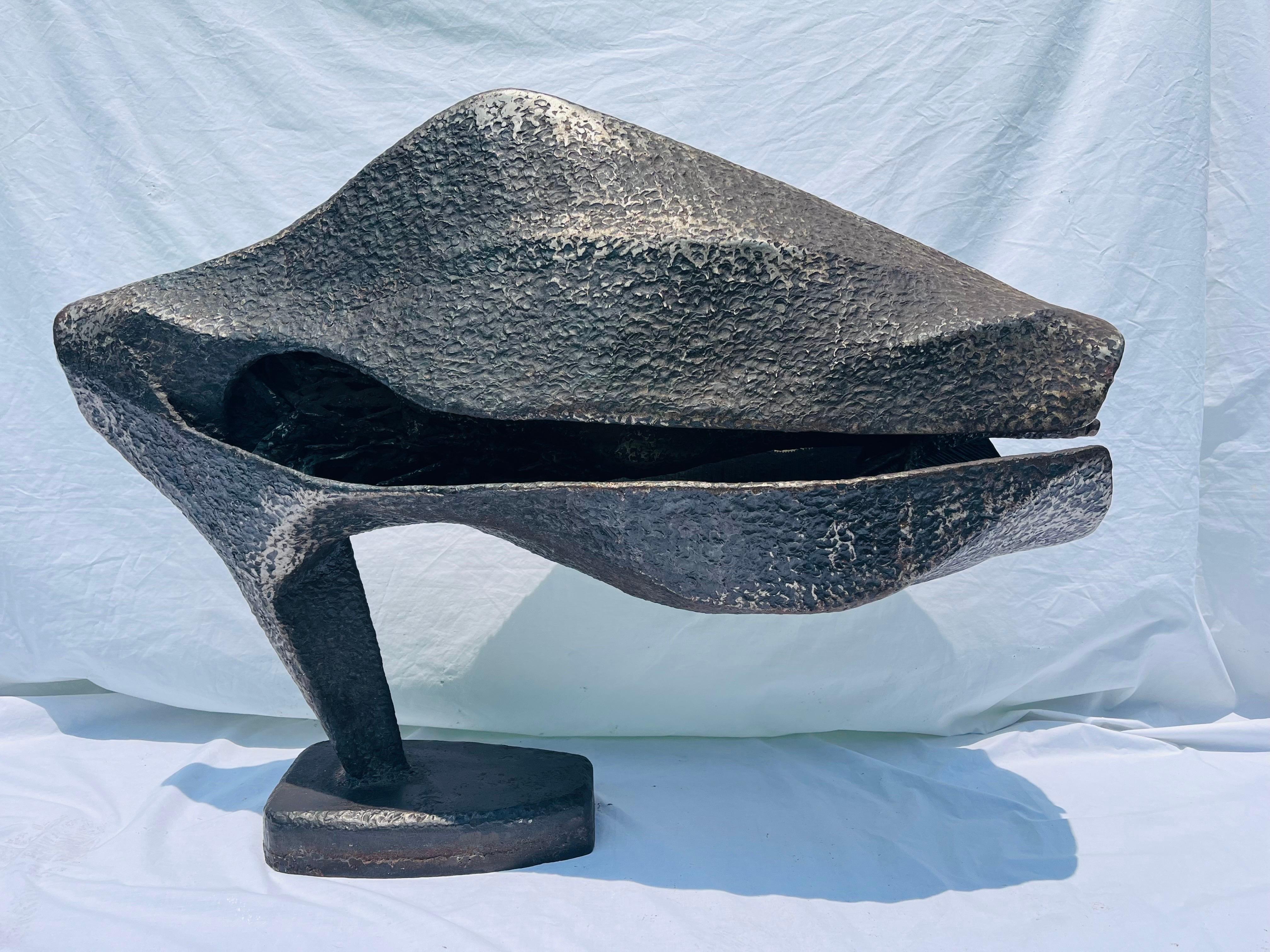 A truly monumental work of art. At three and a half feet wide and over two feet in height, this incredible abstract sculpture commands attention. The non representational, abstract, biomorphic form is the purest embodiment of abstract art, thus