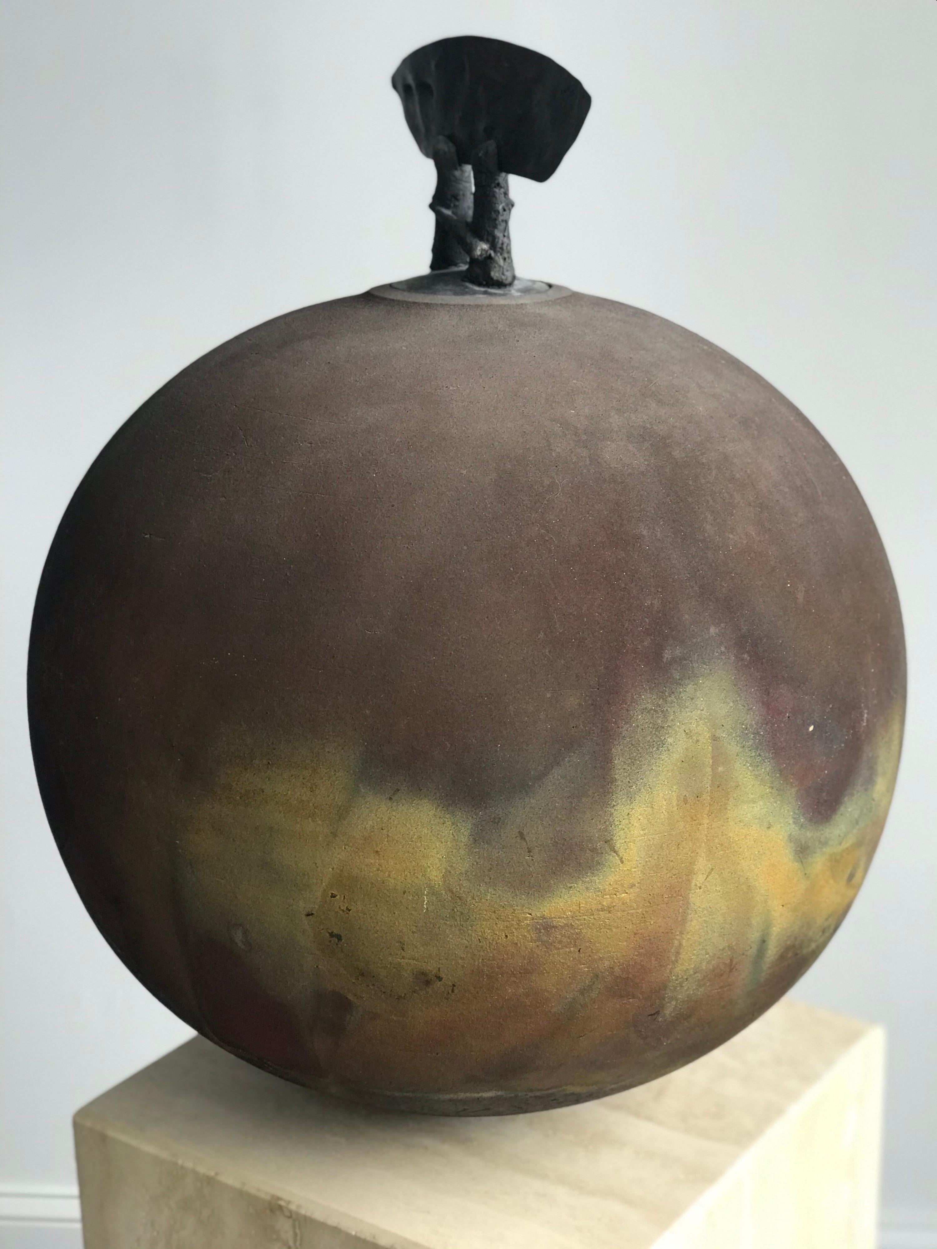 Large and impressive raku pottery sculpture/ vase/ urn. Signed on bottom. Impressive colors and sculpted top.

Please note that measurements are difficult on a piece of this shape. Measurements are within 1/2