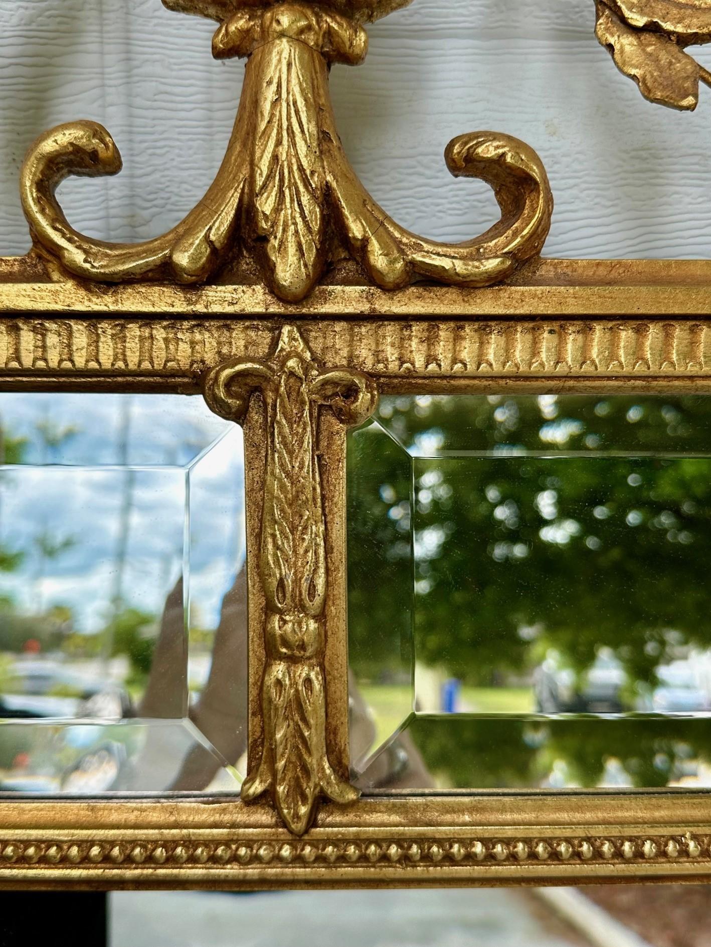 American Monumental Adams Style Carved Giltwood Wall Mirror. For Sale