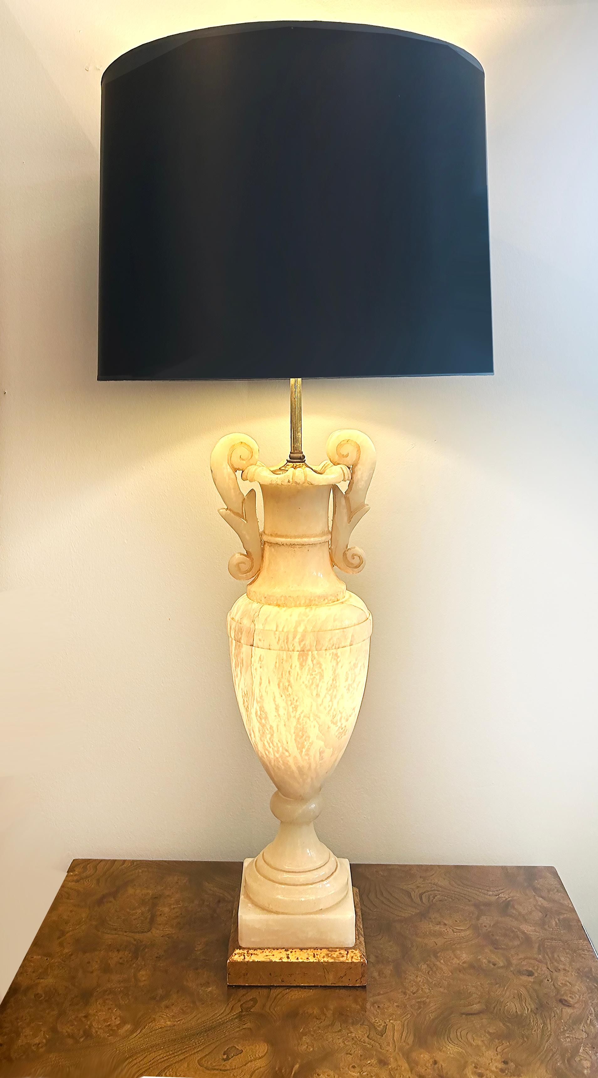 Monumental Alabaster Urn Table Lamps with Interior Lighting, Wired and Working

Offered for sale is a large pair of impressive monumental alabaster urns mounted as lamps.  These lamps are wired with single sockets which accommodate standard bulbs.