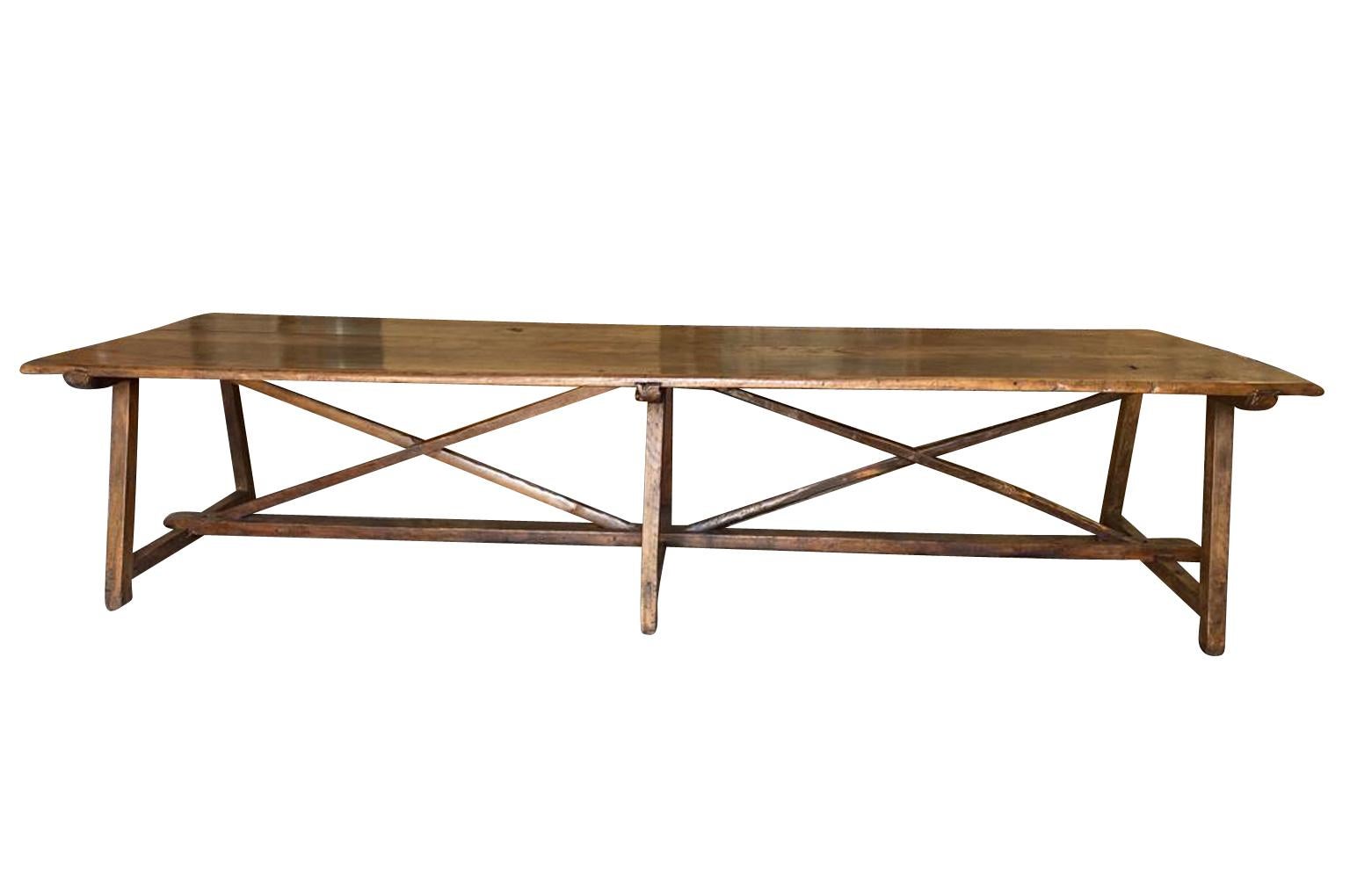 A monumental and exceptional Farm Table - Dining Table from the Piedmont region of Italy.  Beautifully constructed from stunning walnut and chestnut with a very wide plateau and 