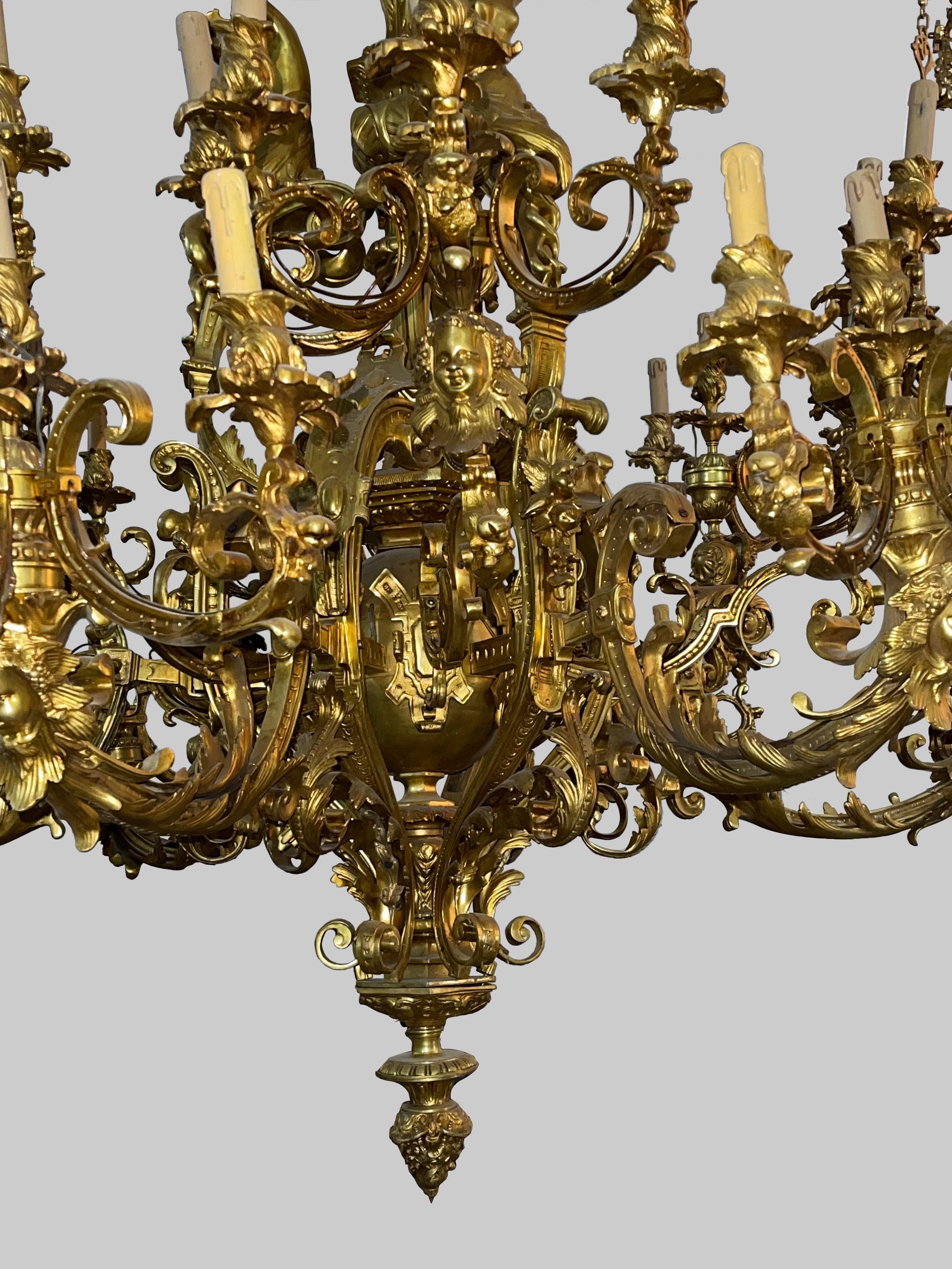 Monumental and impressive 60-light gilt Chandelier, Paris (1320 lbs)

Finely chased and gilded bronze. 60 flames, electrically wired in a bronze frame
Important chandelier bronze in Renaissance style. Lower part of 6 large set of 8 light-arms