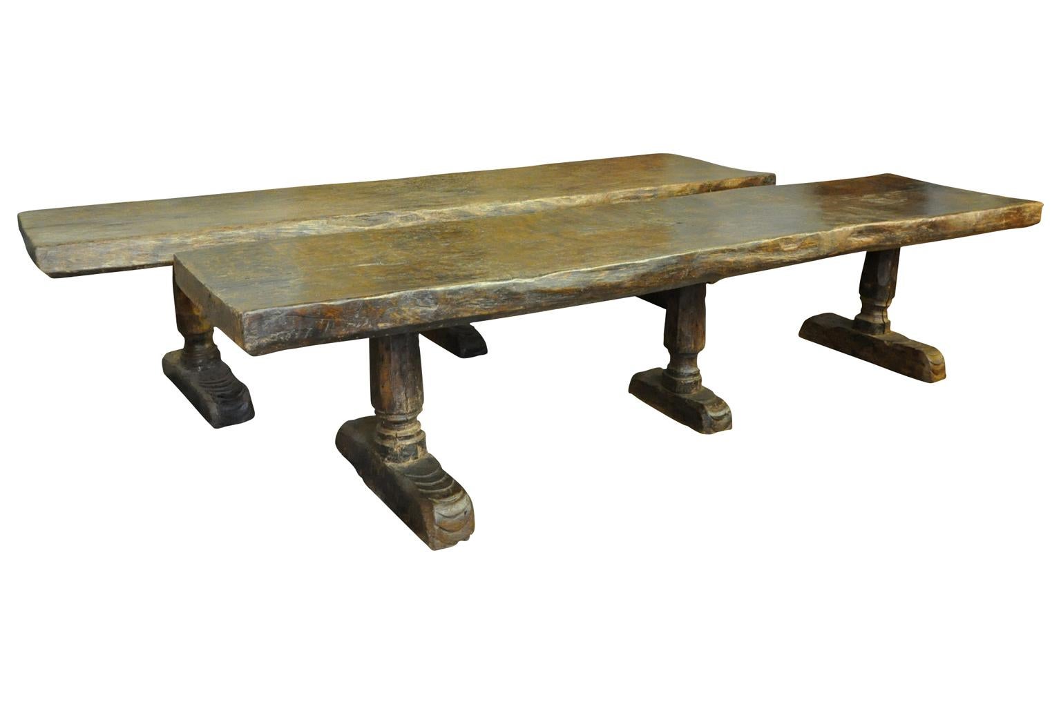 A pair of monumental and very rare 16th century castle tables - trestle tables from the South of Spain. These truly exceptional tables are very sturdily constructed from richly stained green oak with sensational and very thick solid board tops,