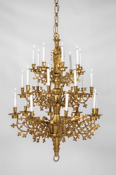 Monumental antique cast and polished brass neogothical three tier chandelier