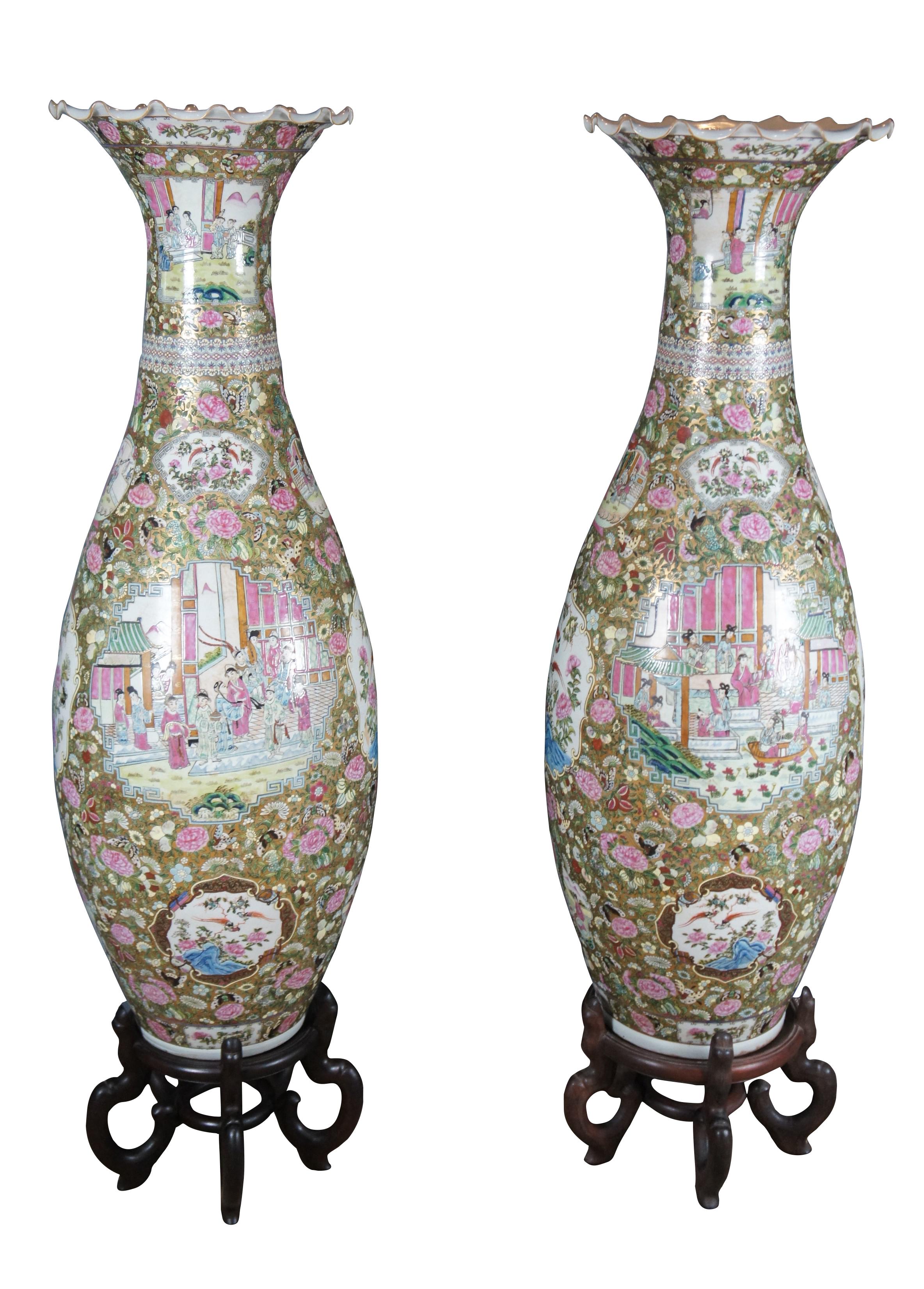 Rare pair of two monumental antique Chinese Qing Dynasty palace urns or temple vases, circa 1900s.  Made of porcelain featuring chinoiserie Canton Famille Rose and medallion design with ruffled serpentine edge, baluster shaped body, and ornate