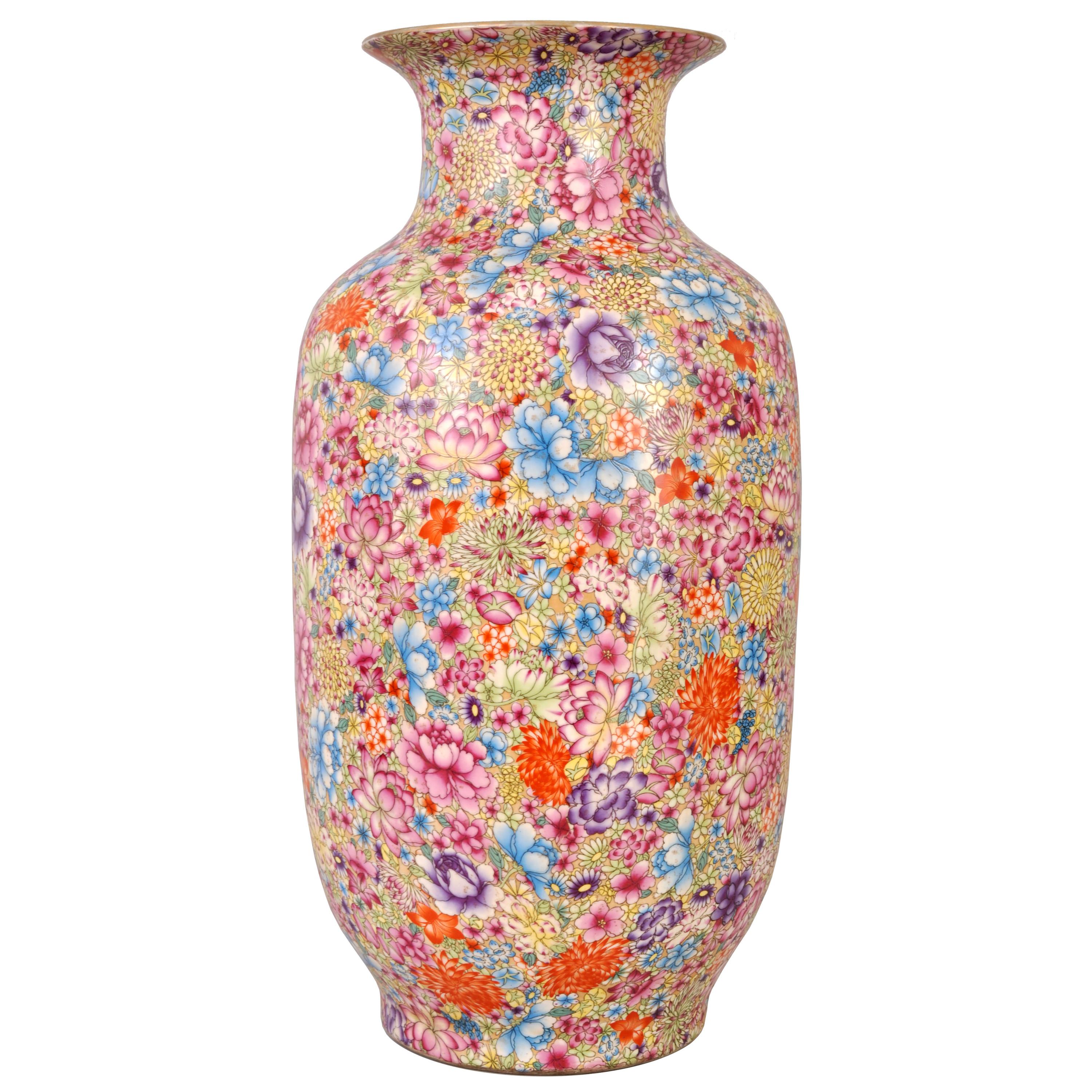 A monumental antique Chinese 'Thousand Flowers' Qing Dynasty (1644-1912) porcelain vase, circa 1900. The vase of significant proportions at 24