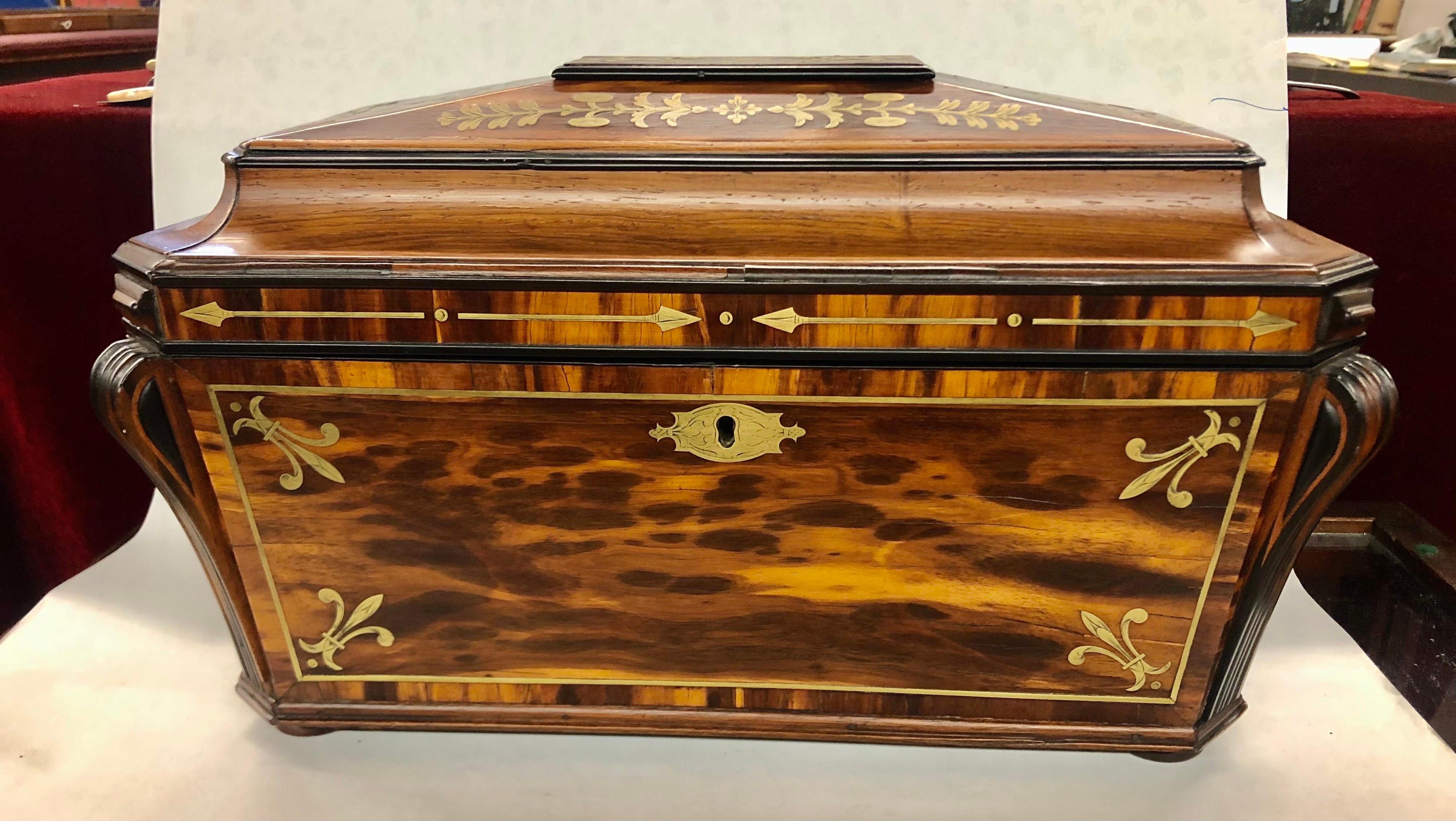 PLEASE NOTE EXTRAORDINARILY LARGE DIMENSIONS!!!
Quite possibly the largest and finest antique English inlaid rosewood monumental size Sarcophagus shape tea caddy we have ever procured. In mint condition, this caddy retains its exceptionally hand