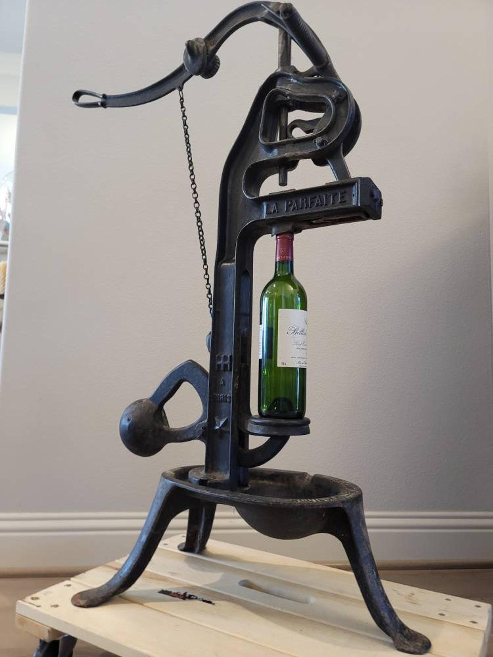 A magnificent French 'La Parfaite' cast iron floor standing winery cork press. circa 1890s-1910s

The fine art of winemaking is brought to life by this scarce antique Parisian wine bottle corker. 

Born in Paris, France, around the turn of the