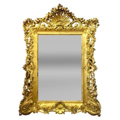 Monumental miroir français ancien de style Louis XV en bois doré sculpté