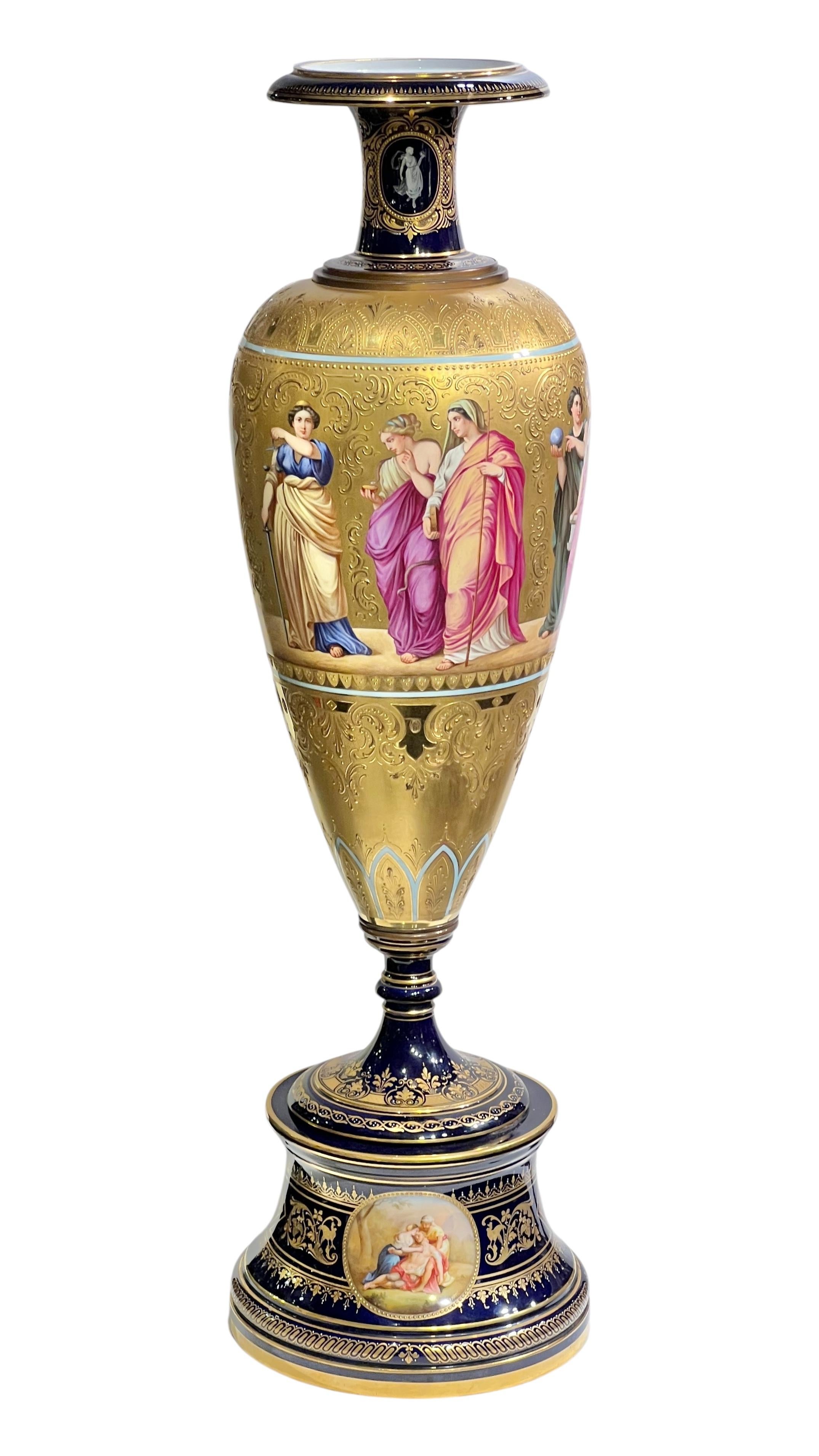 Impressive monumental 19 century antique 38 inch tall  Royal Vienna style   porcelain vase, featuring exceptional painted figures of the four cardinal virtues and muses, on a textured gilt ground over cobalt blue glaze, plus finely painted