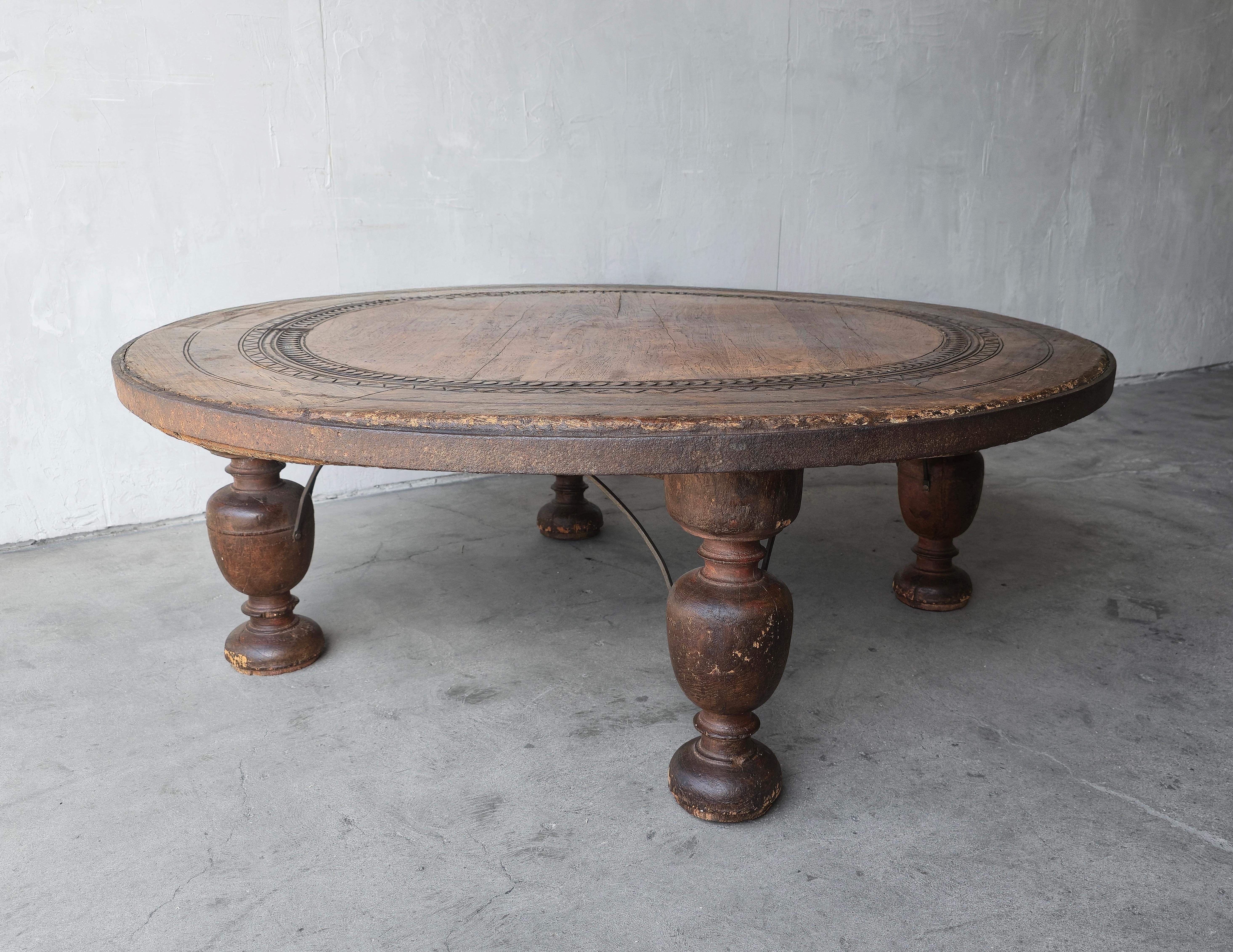 If wabi and rustic is your decor style, this massive (almost 5ft) antique wooden coffee table will feel right at home.   A great antique piece that's also a beautiful and functional piece of furniture.  Table beautifully worn wood top with carved