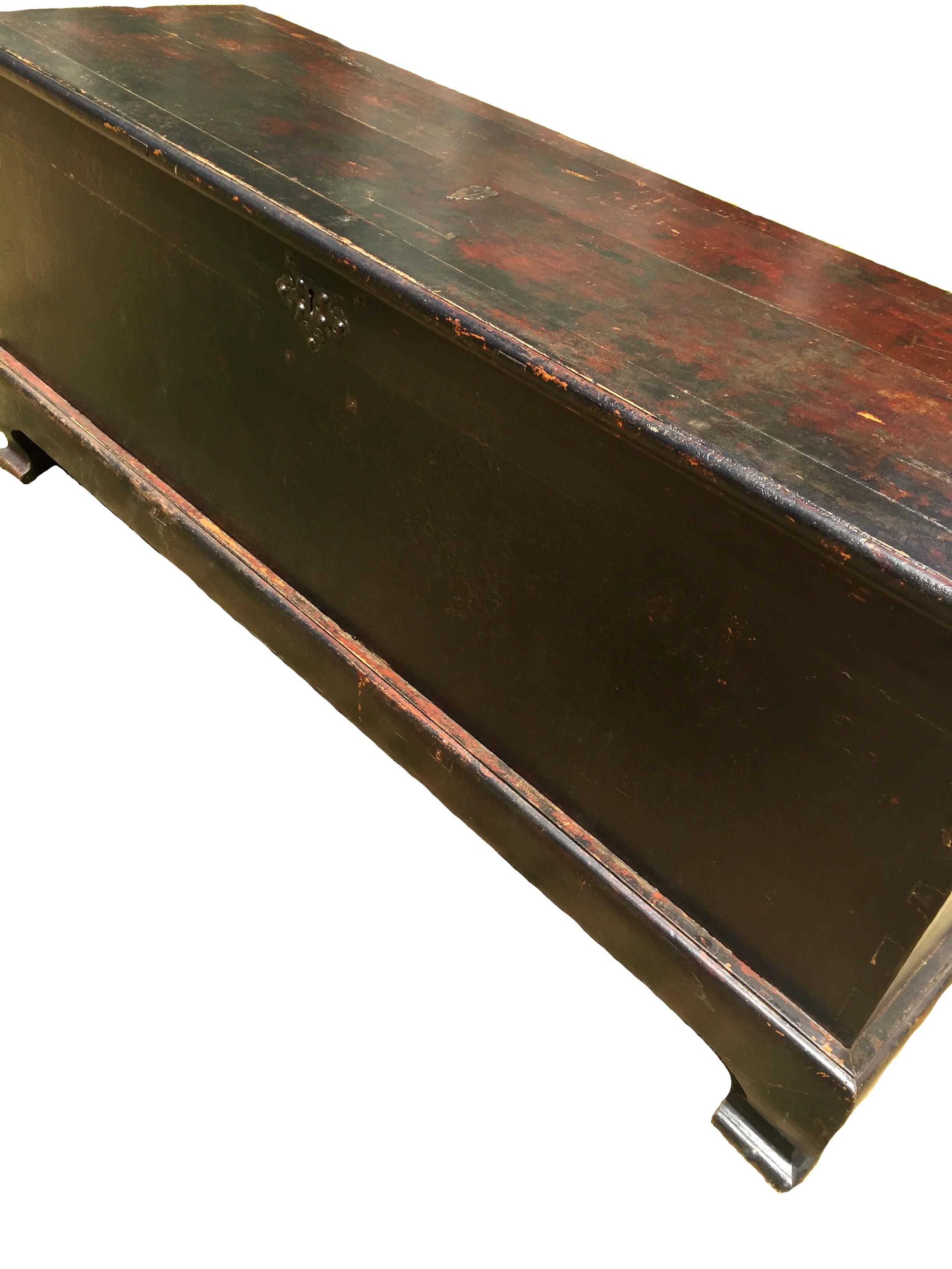 This is an extremely heavy, substantial, over scale trunk from Shan Xi province, China's ancient frontier. The completely solid wood trunk has a thick top that displays beautiful patina achieved over time. The framework and legs are solid and