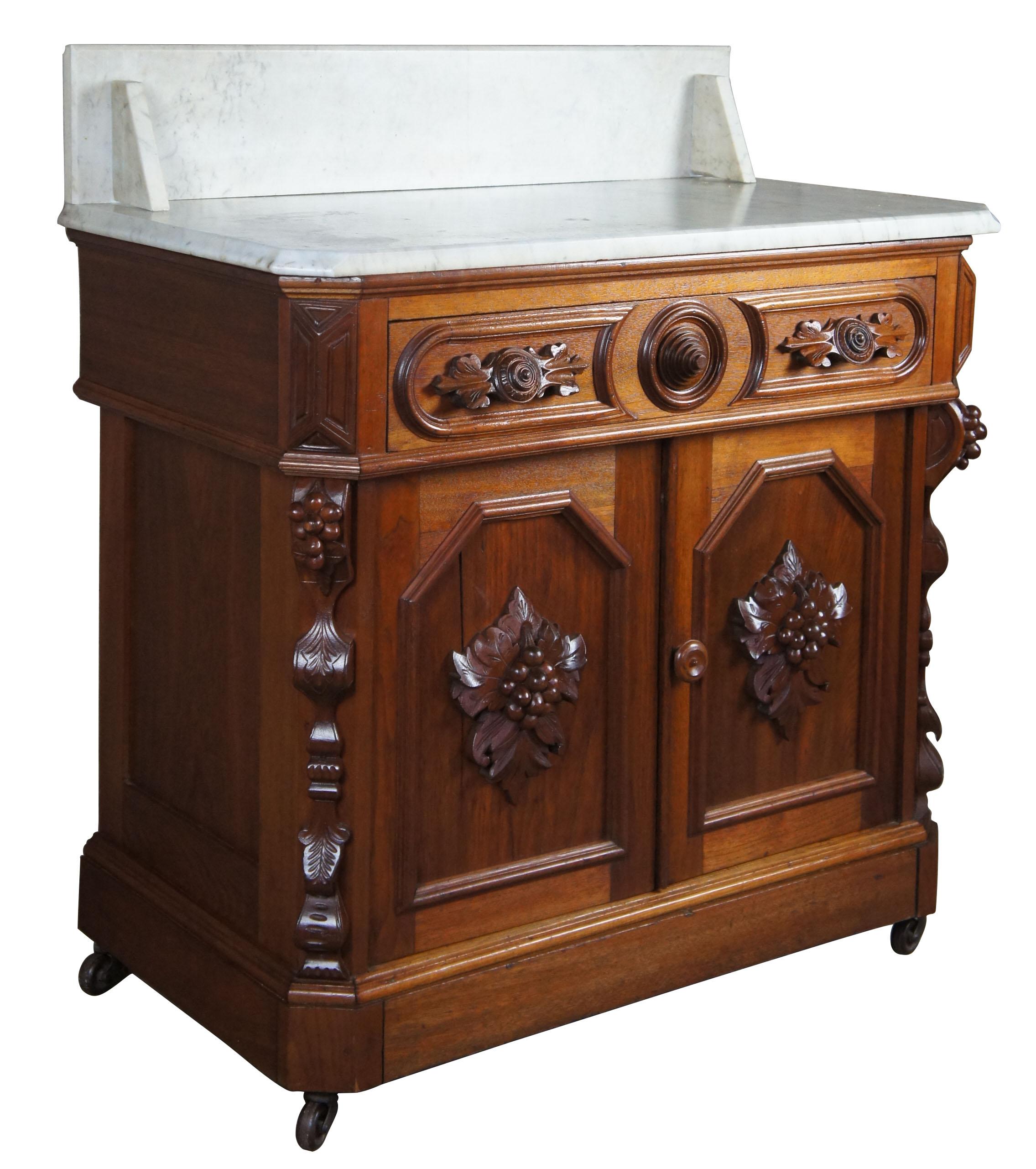 Monumental antique Victorian Eastlake carved walnut marble washstand nightstand

Mid-19th century Victorian era walnut carved washstand. Features meticulously detailed fruit and nut carvings, a hand dovetailed drawer with medallion pulls and