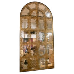 Monumental Arched Mirror with Aged Glass and Golden Patina