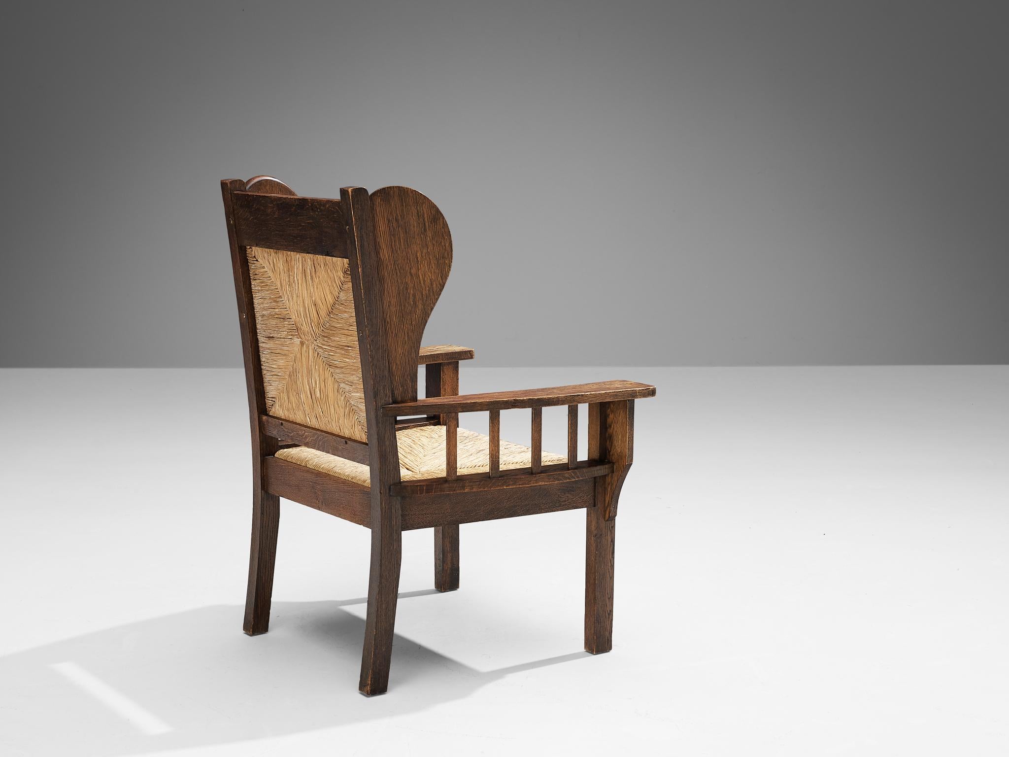 Mid-20th Century Monumental Armchair in Oak and Rush  For Sale