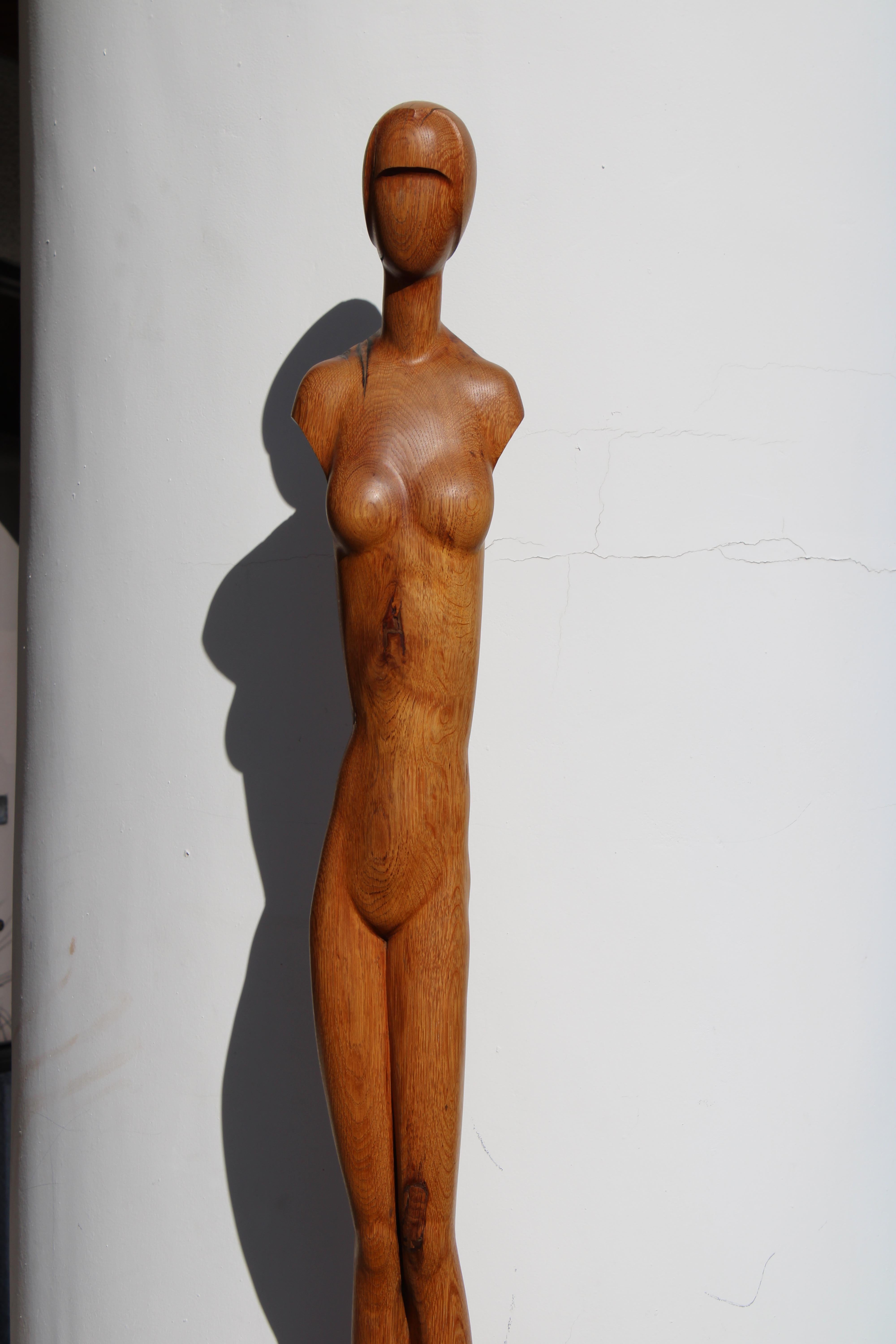 Monumental six foot Art Deco wood sculpture of a woman.  We cannot find any signature but, what a statement.  We were told this piece was made in Europe, possibly Belgium or France.  Total measurement of sculpture is 7